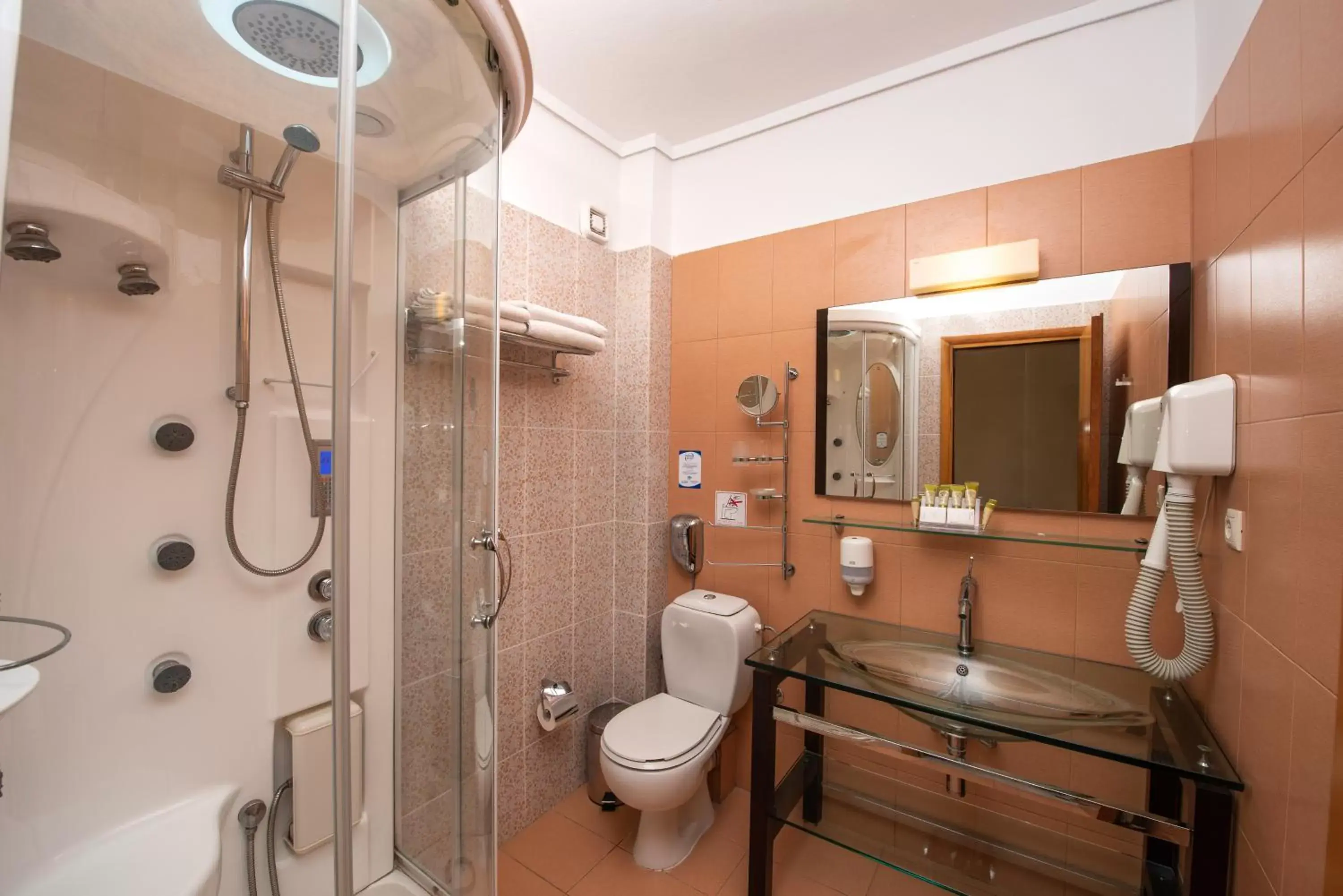 Shower, Bathroom in Heliotrope Hotels