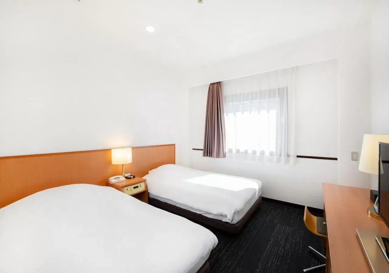 Bed in TKP Sunlife Hotel