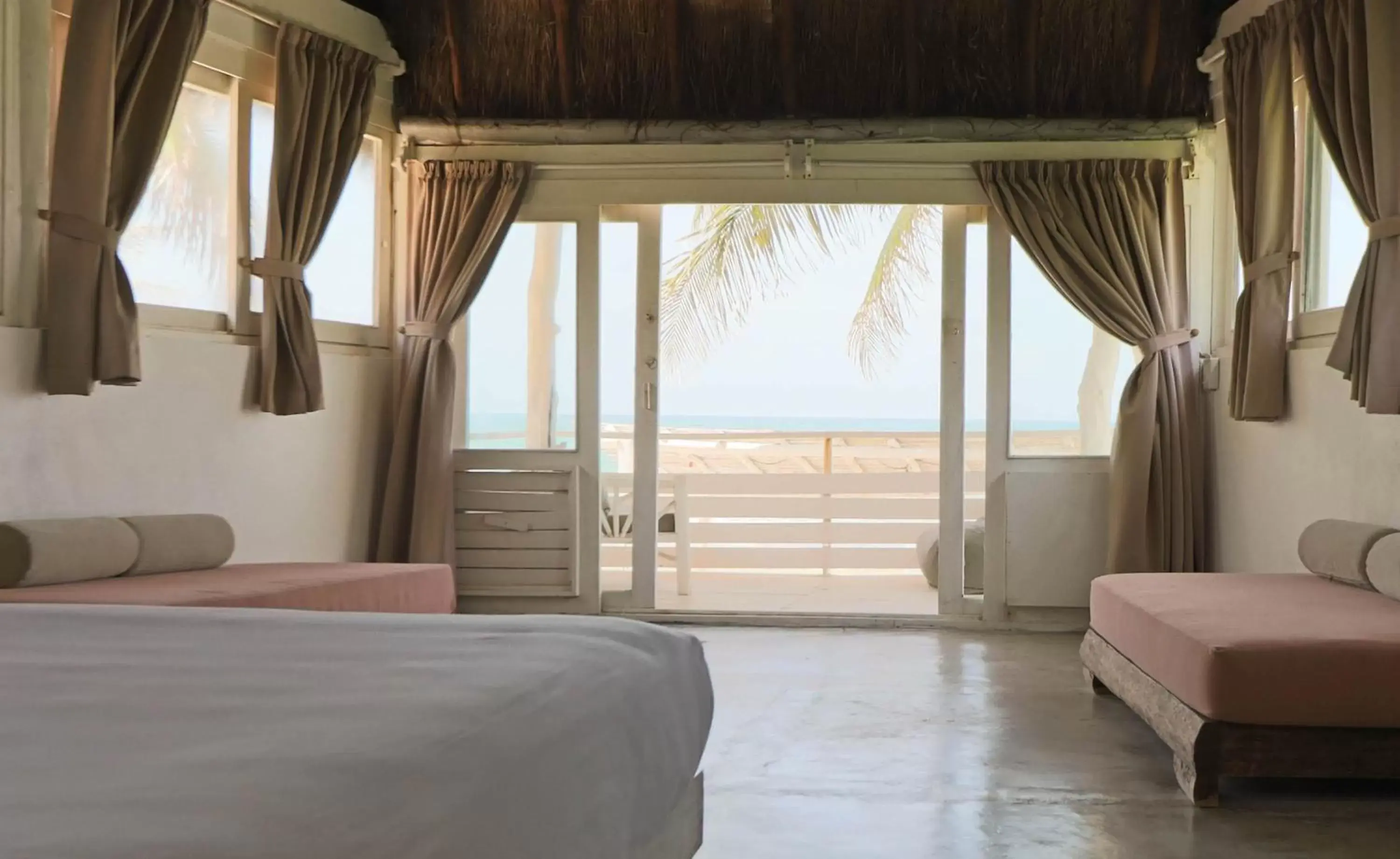 Photo of the whole room, Bed in Tuup Tulum Oceanfront or road side rooms