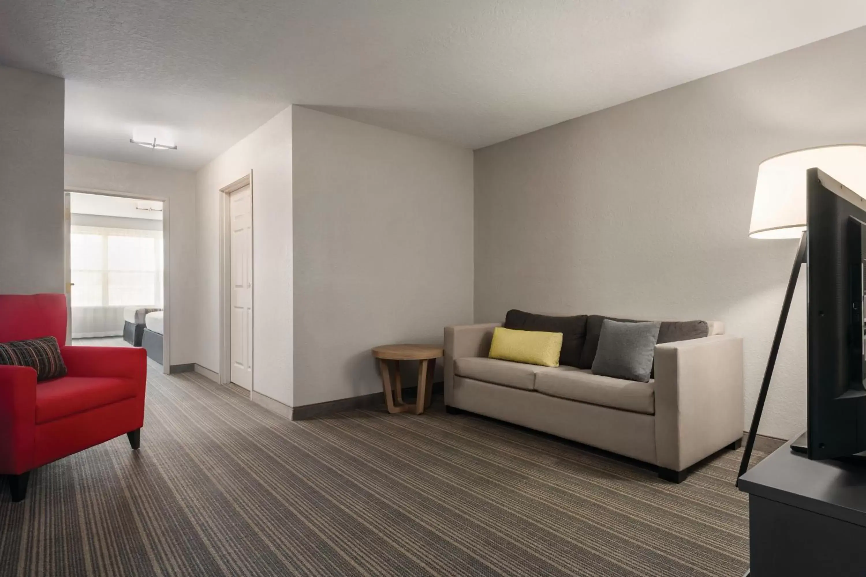 Living room in Country Inn & Suites by Radisson, Green Bay East, WI Living room in Country Inn & Suites by Radisson, Green Bay East, WI