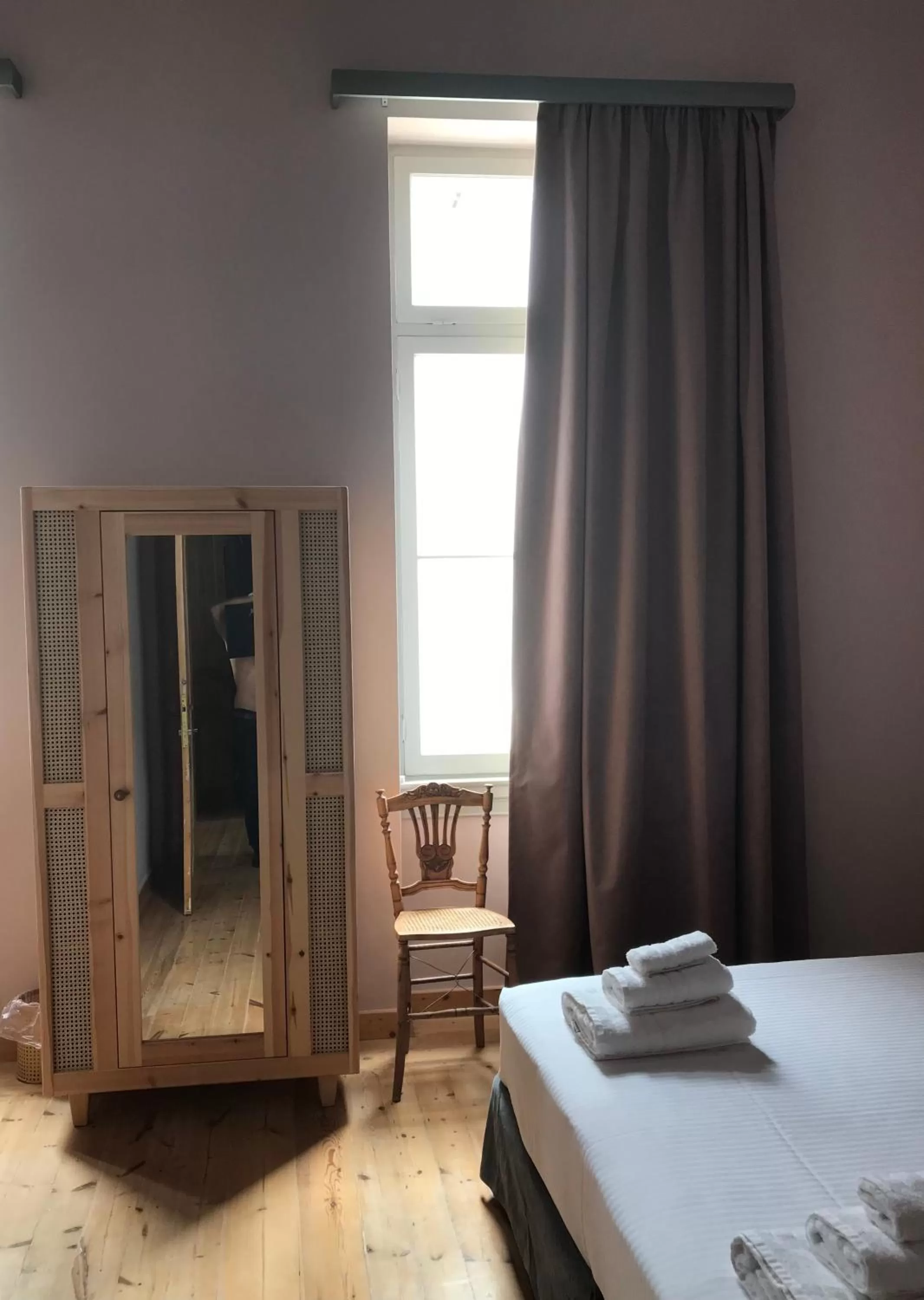 Photo of the whole room, Bed in VASILIKON Hotel 1888 the past is present HISTORICAL PRESERVATION MONUMENT