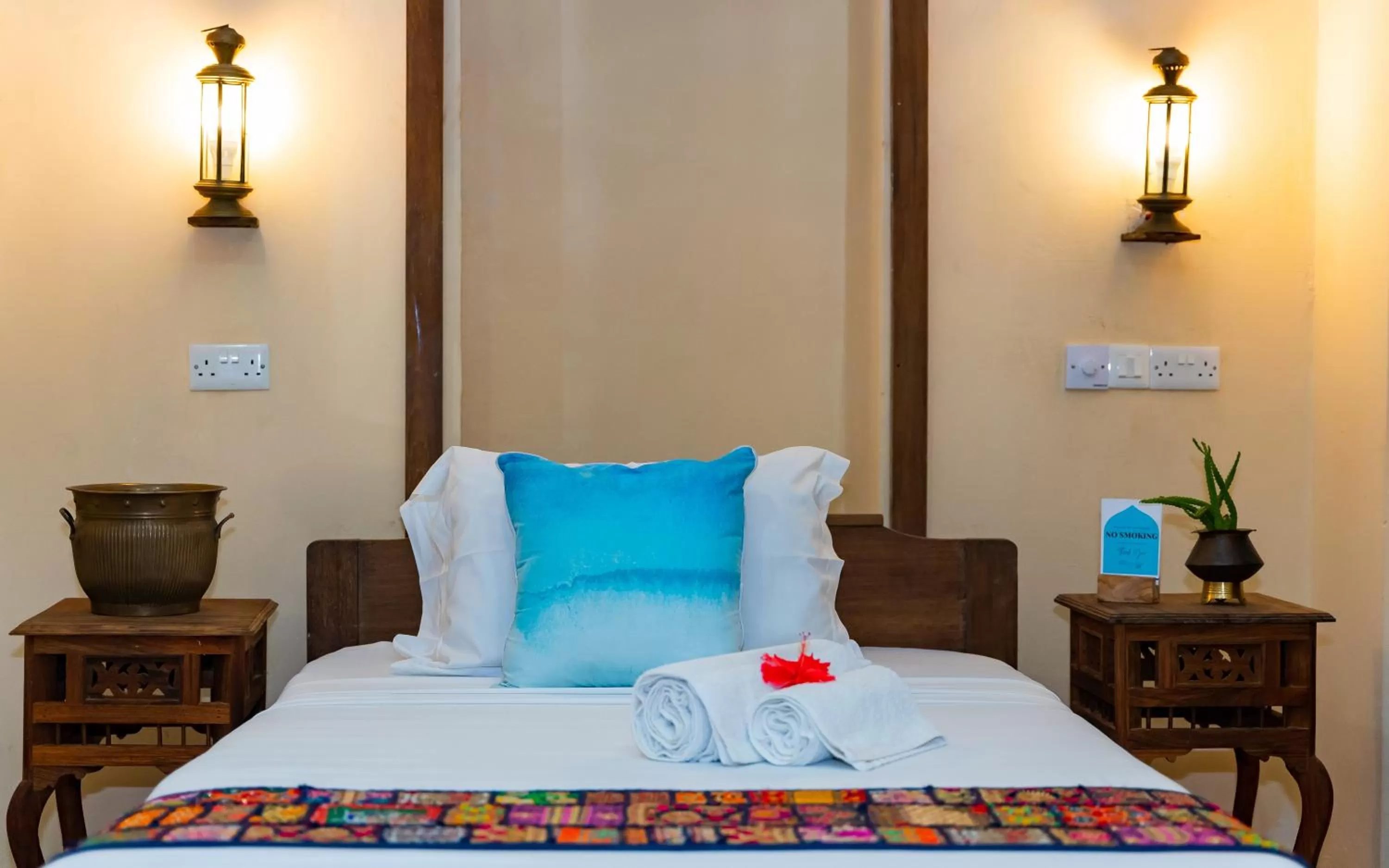 Bed in Emerald Palm Boutique Hotel