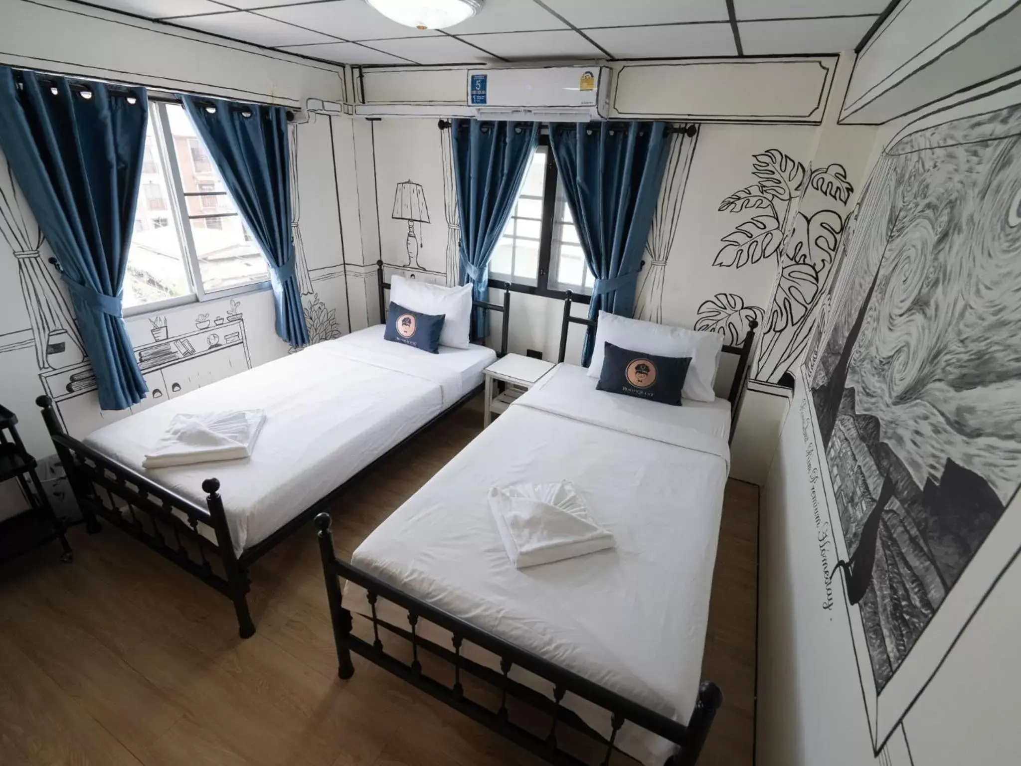 Bed in RoomQuest Chiang Mai Tha Phae Bed in RoomQuest Chiang Mai Tha Phae