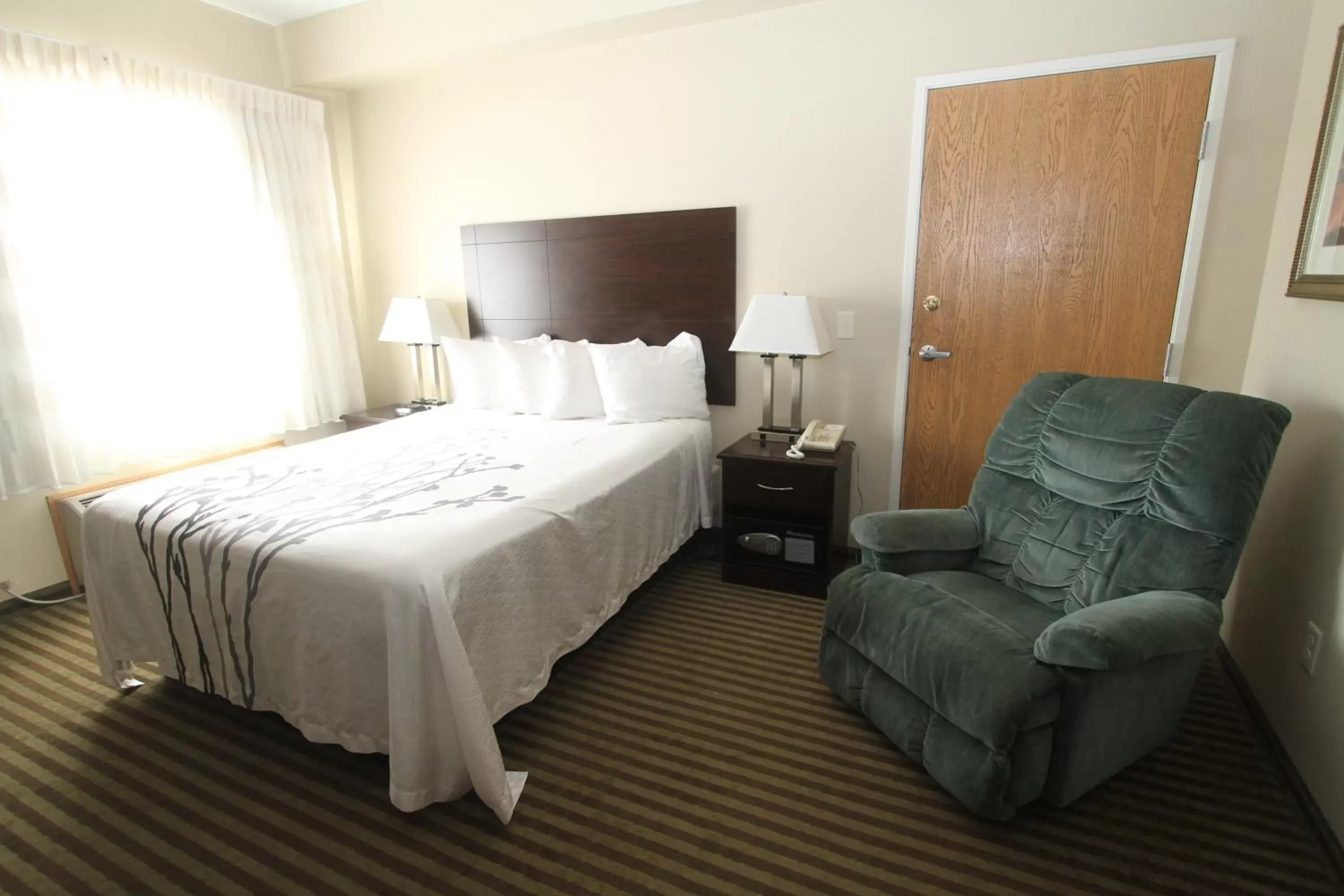 Bed in Bowman Inn and Suites