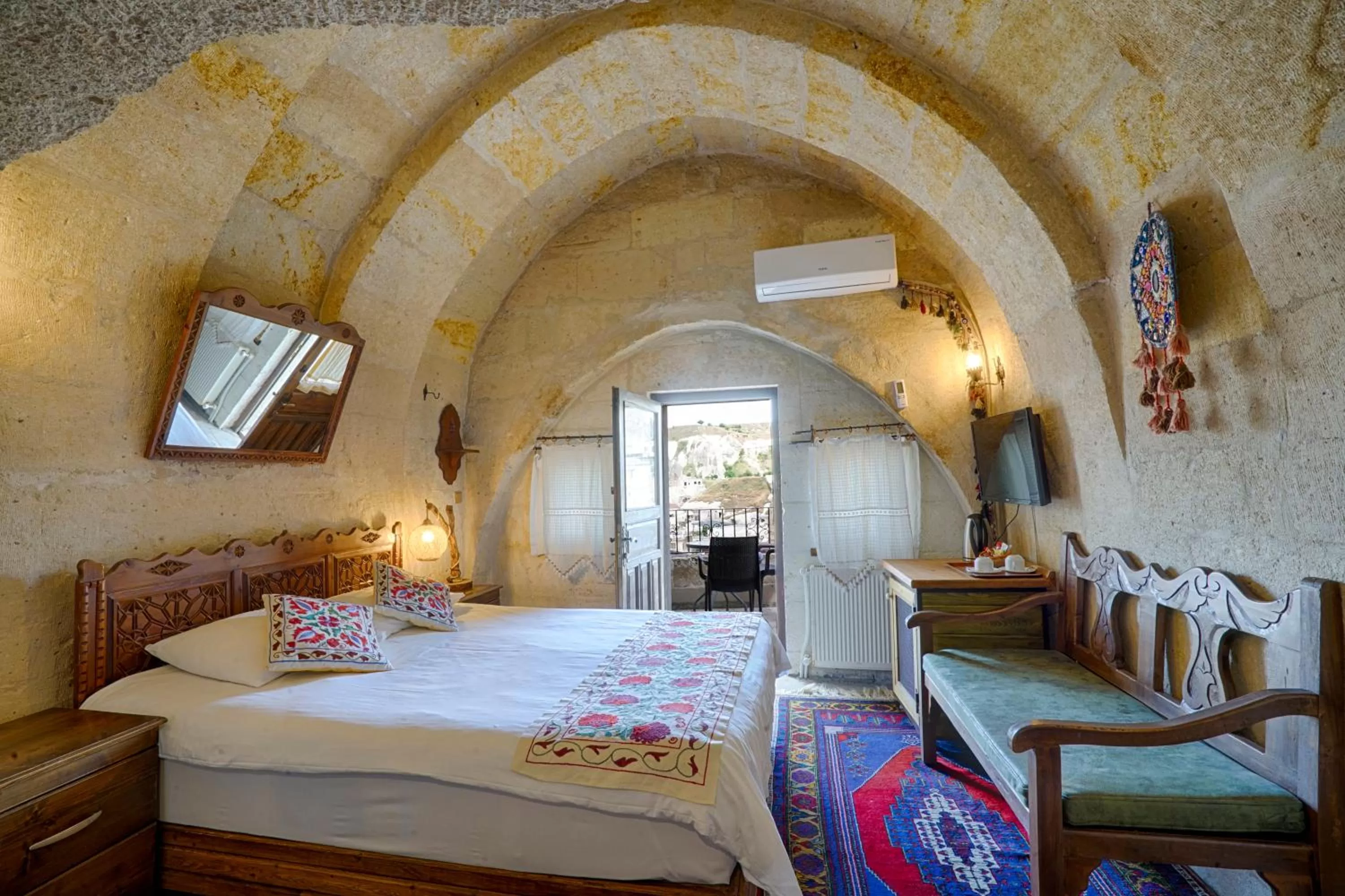 Bed in Tulip Cave Suites