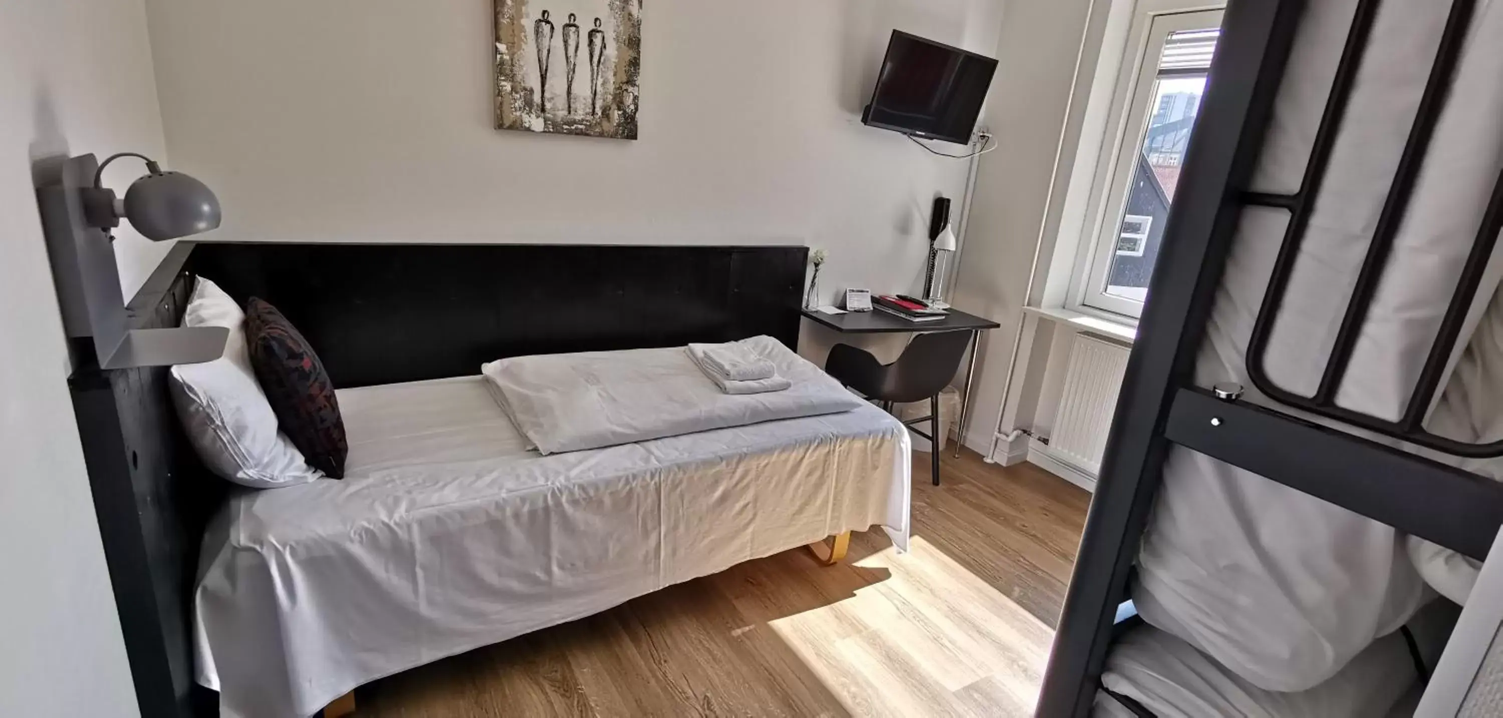 Bed, Seating Area in Hotel Frederikshavn