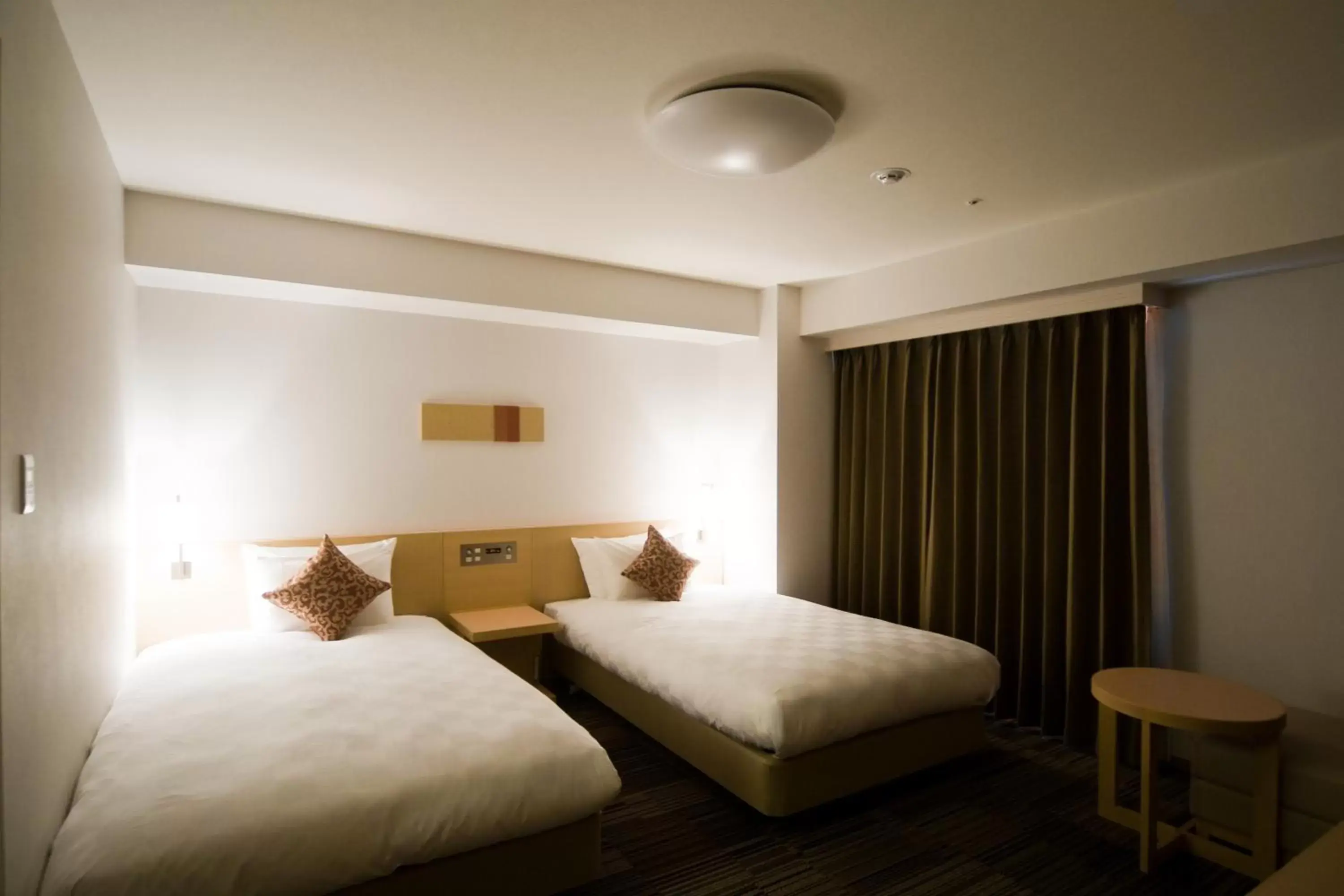 Photo of the whole room, Bed in Daiwa Roynet Hotel Osaka-Uehonmachi
