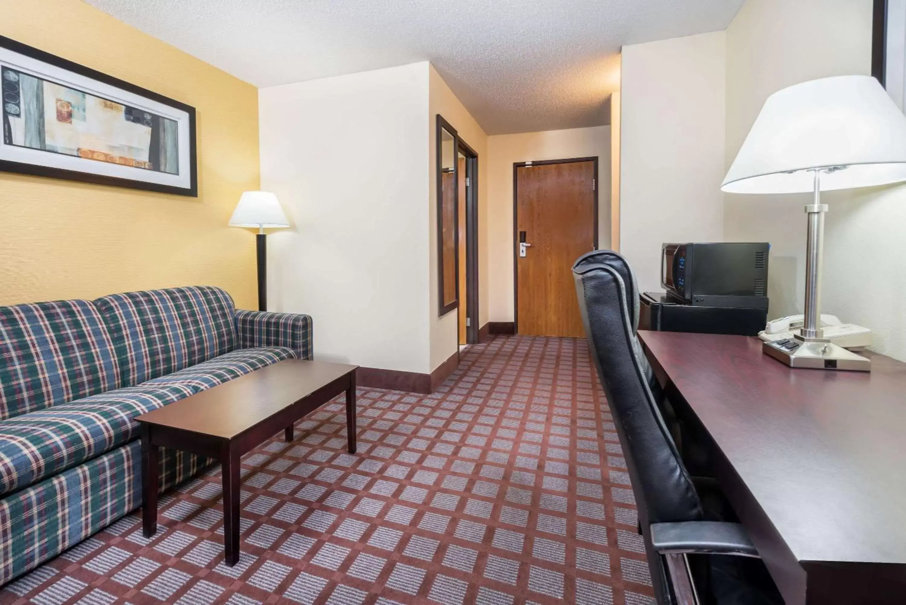 Photo of the whole room, Seating Area in Super 8 by Wyndham Bloomington, Indiana