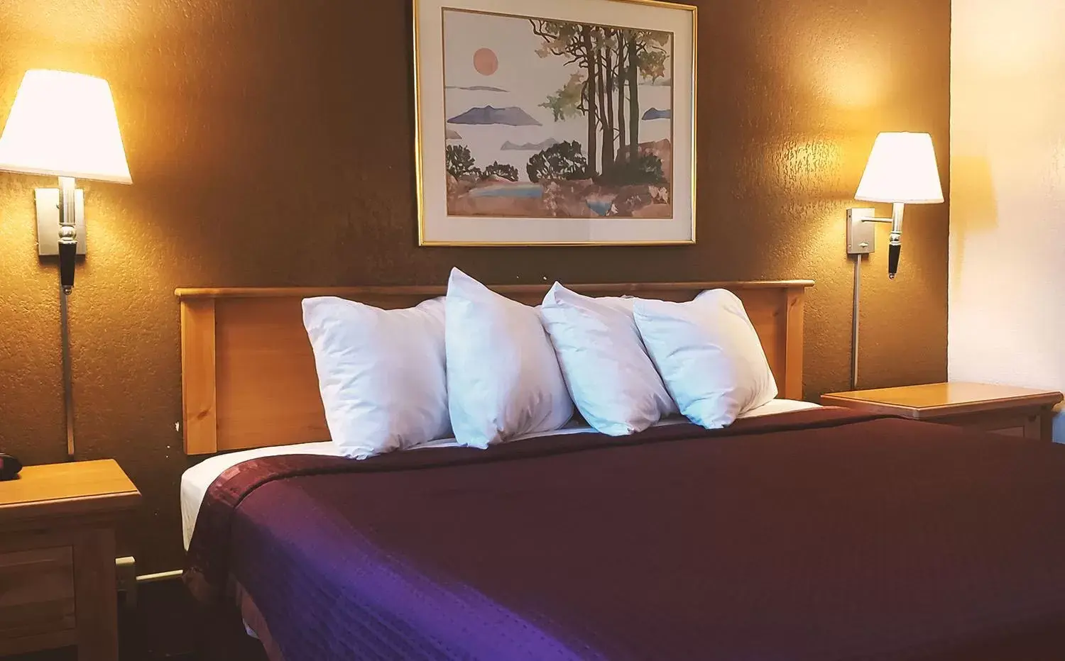Bed in Coratel Inn & Suites by Jasper Mankato