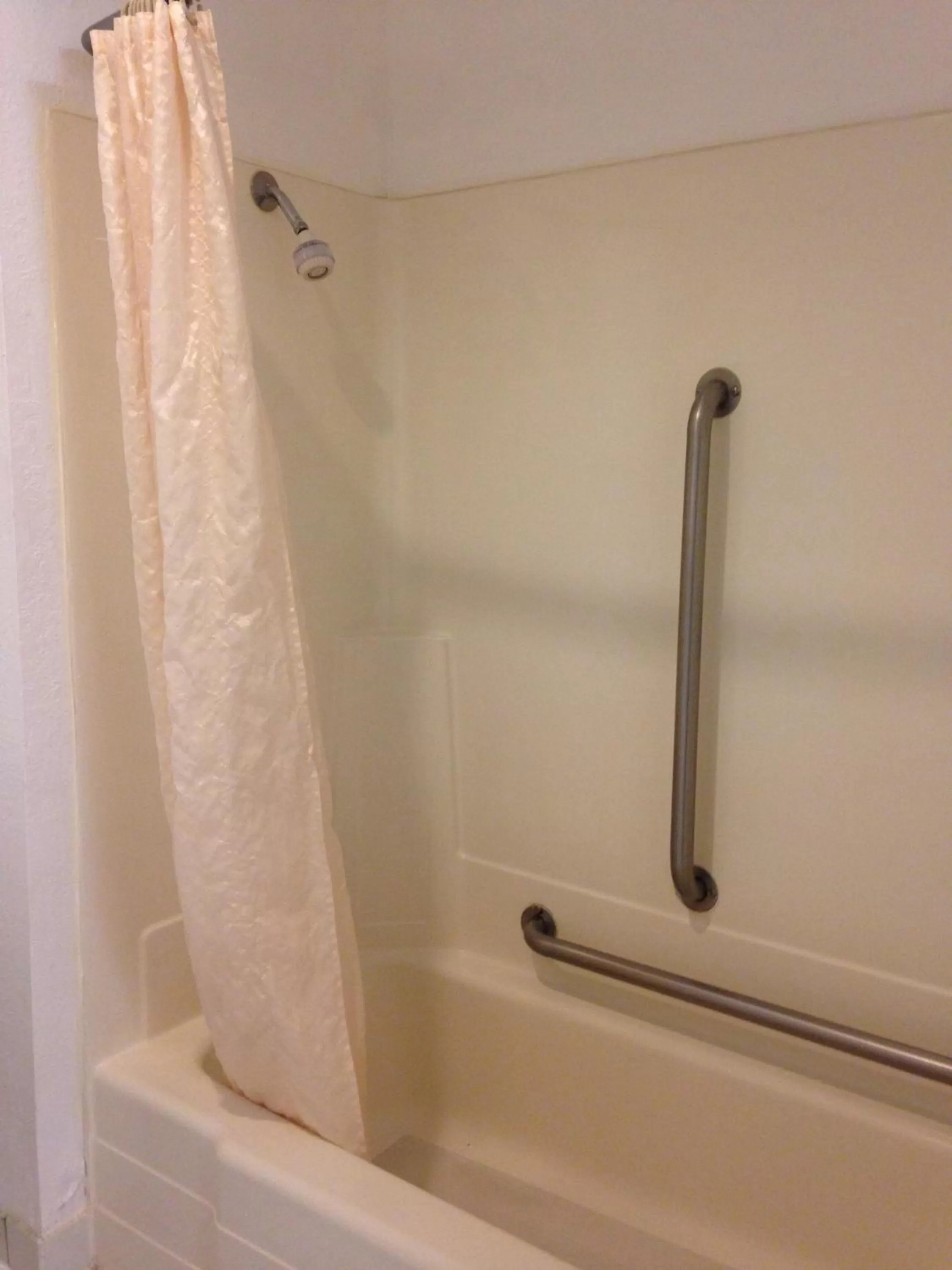 Bathroom in Travelodge by Wyndham Brooklyn Center