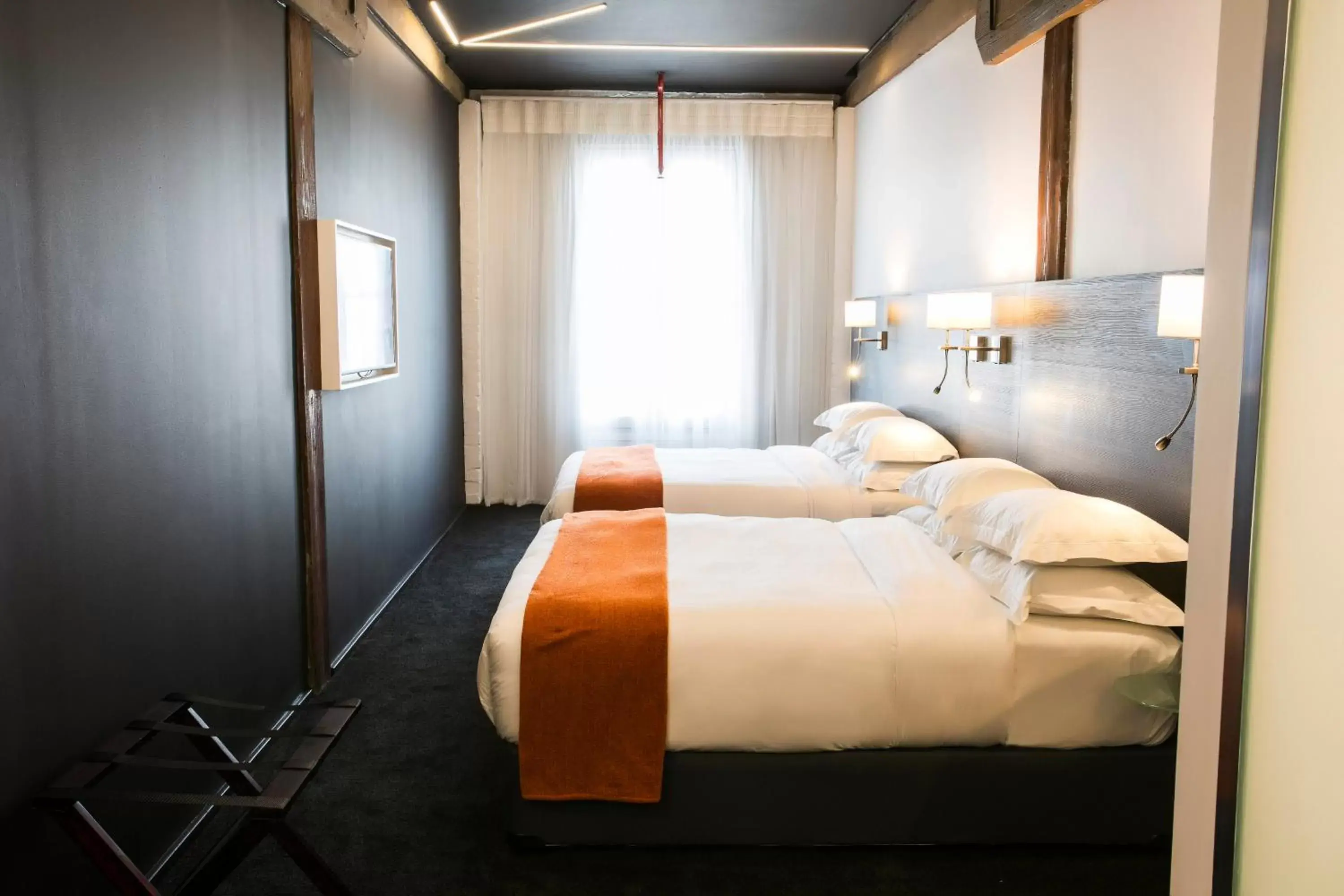 Bed in Signature Lux Hotel by ONOMO, Waterfront