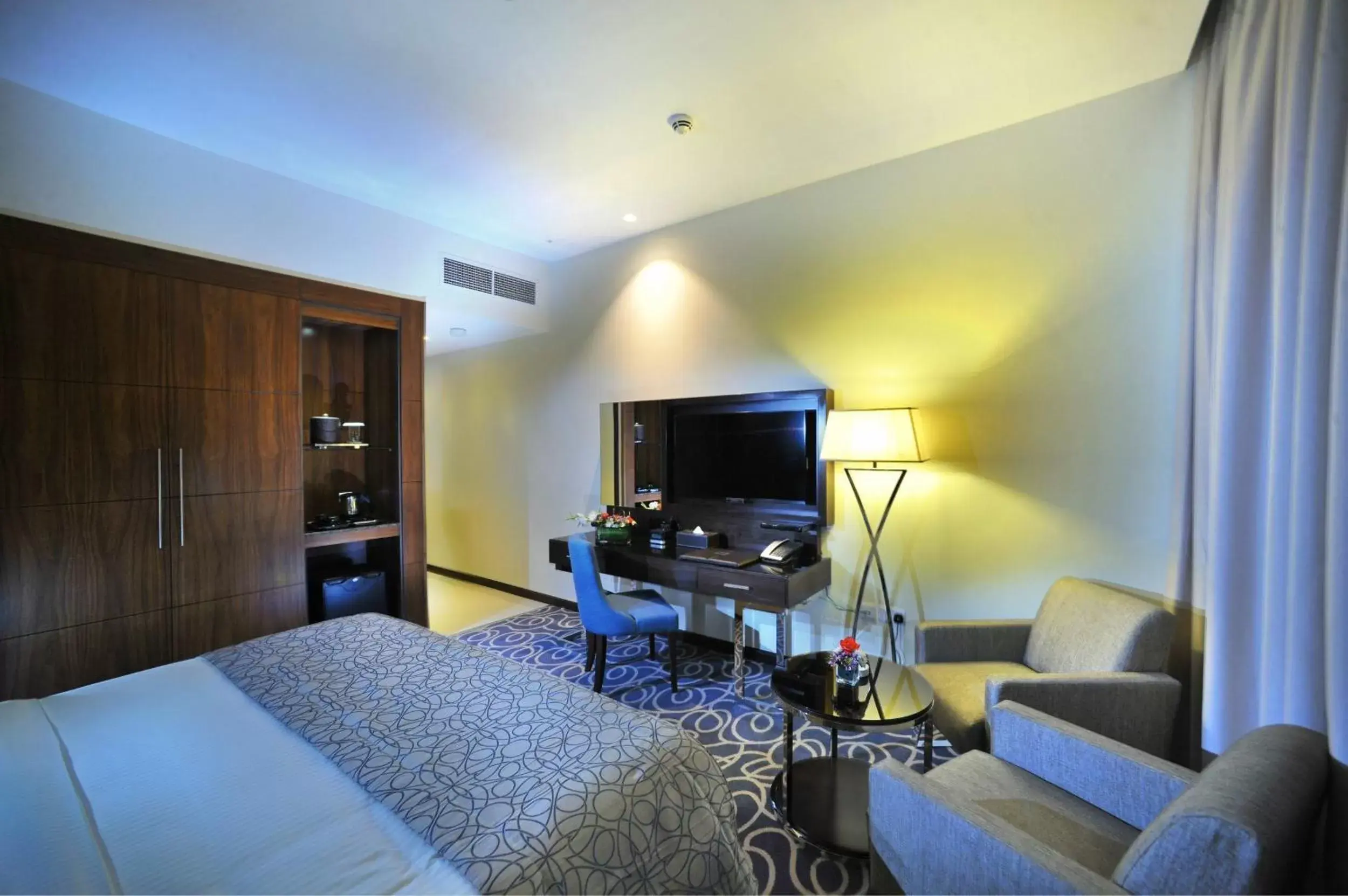 Photo of the whole room, TV/Entertainment Center in Ramada Abu Dhabi Corniche