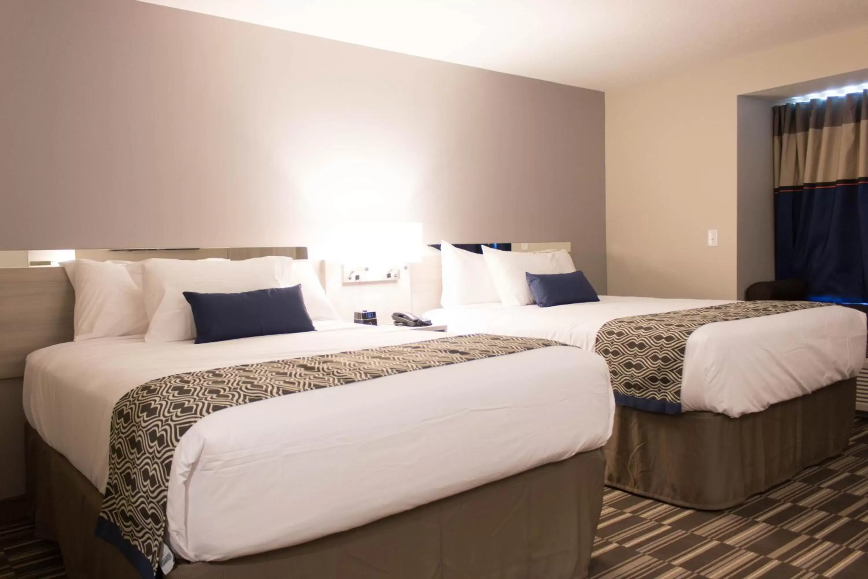 Bed in Microtel Inn & Suites by Wyndham Springville