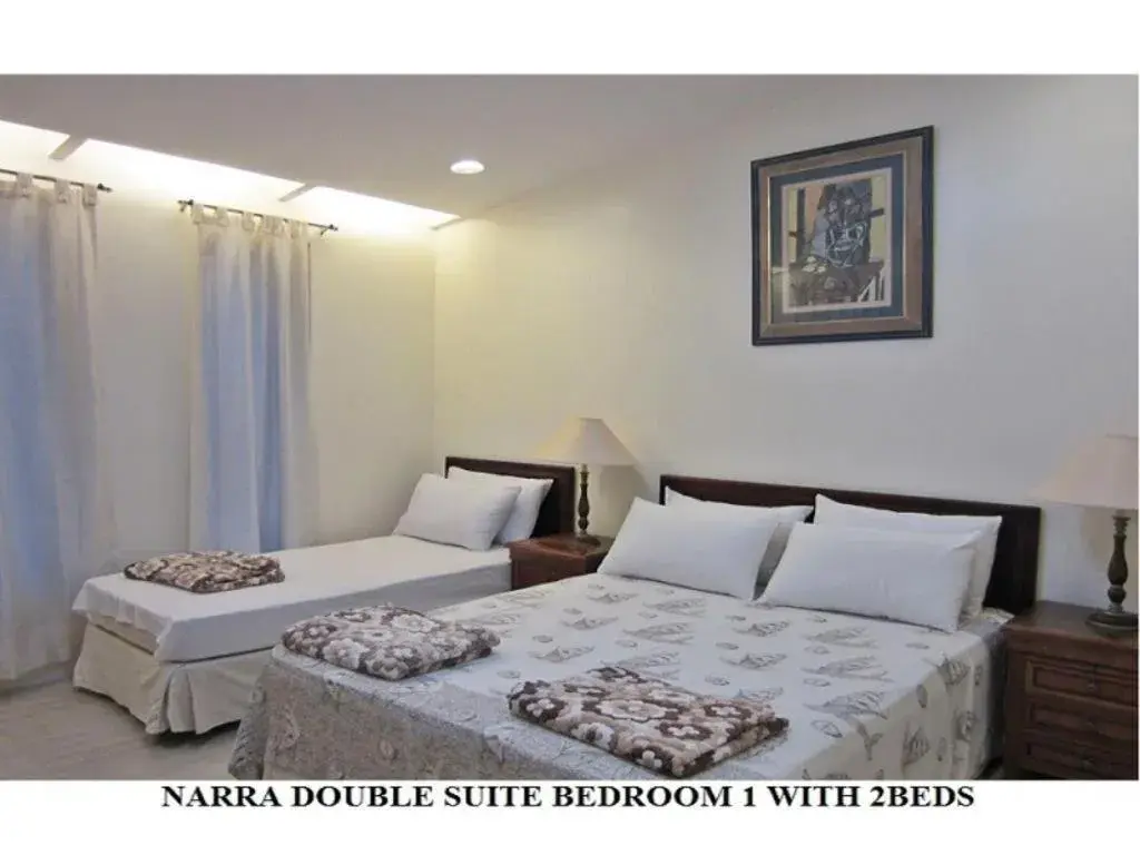 Bed in Agreeable Family Baguio Suites