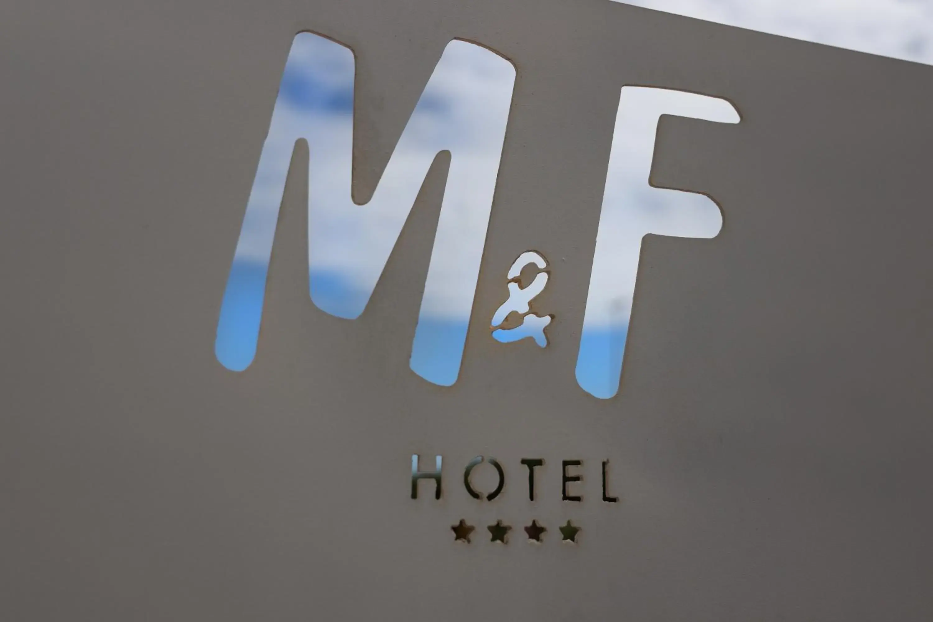 Property logo or sign in M&F Hotel