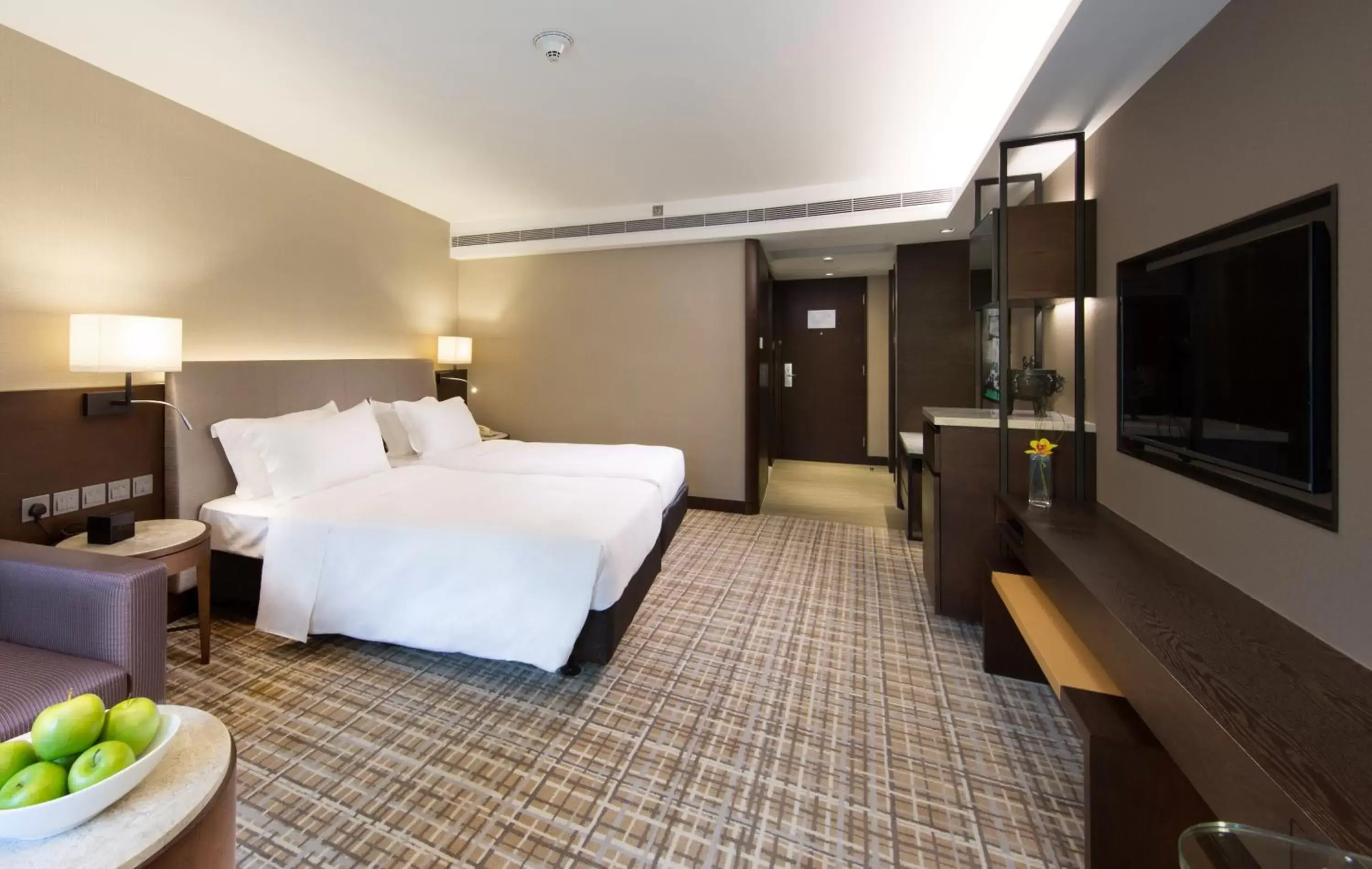 Bed in New World Millennium Hong Kong Hotel