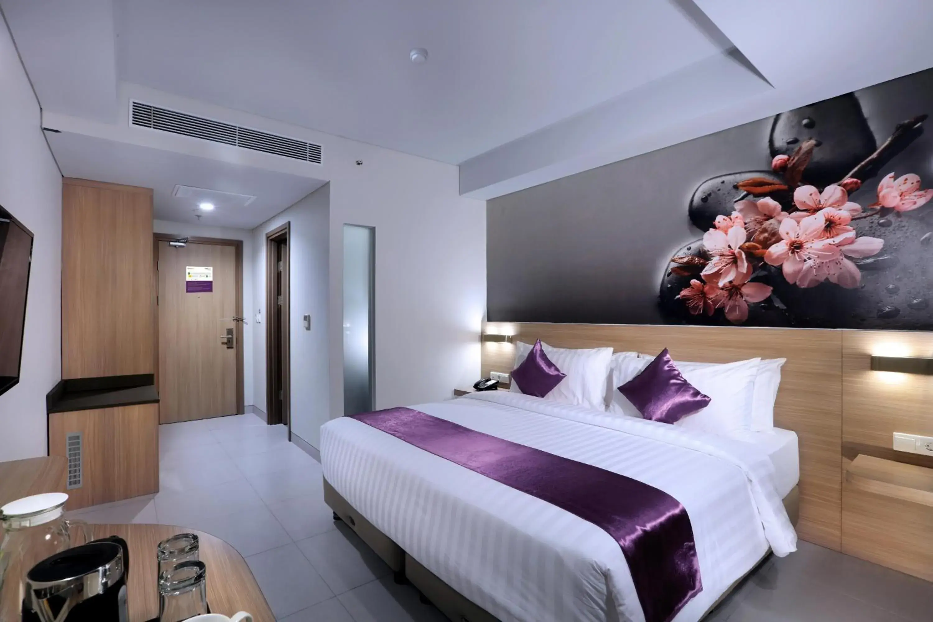 Bed in Quest Hotel Cikarang by ASTON