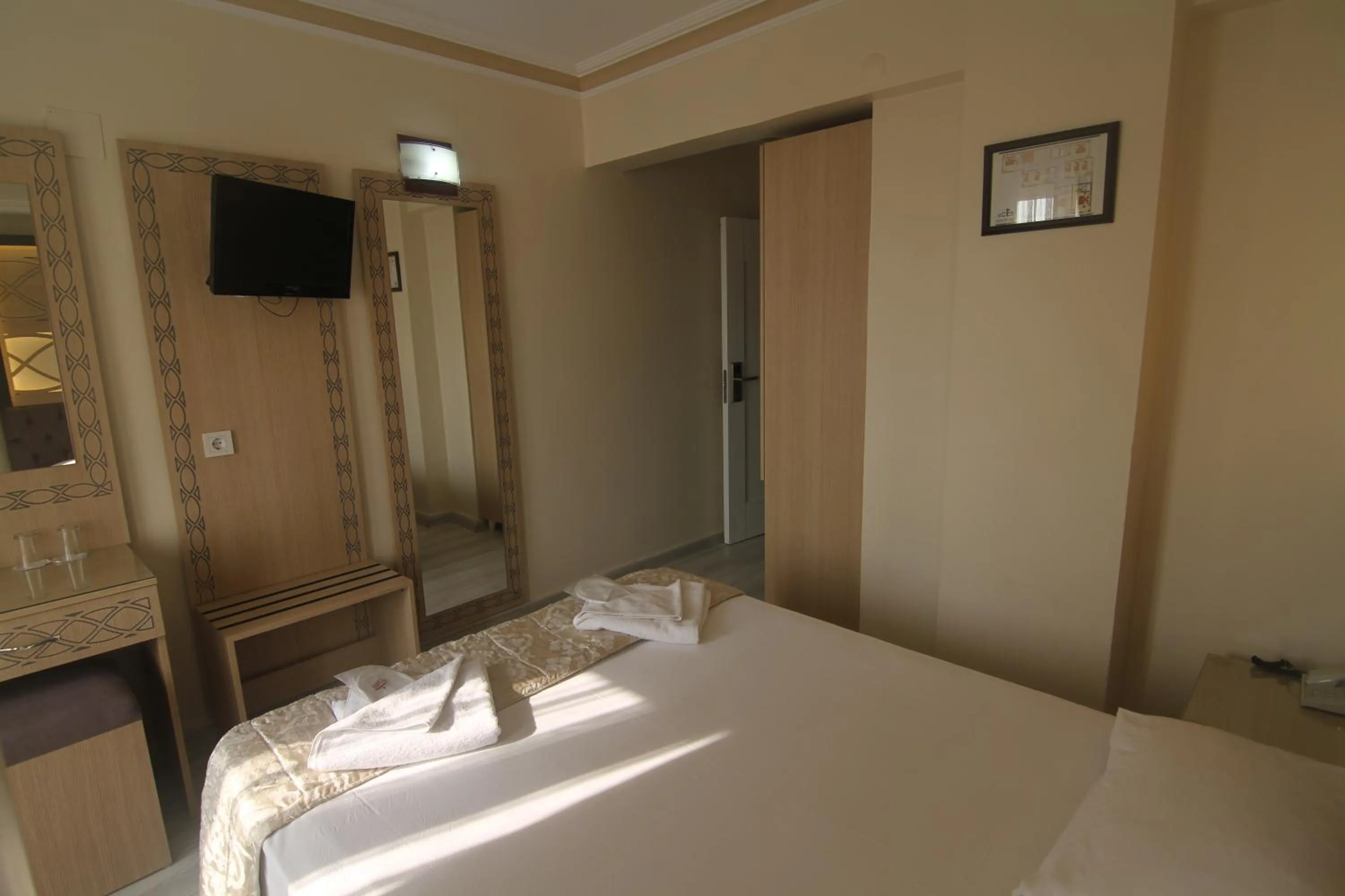 Bed in Grand Liza Hotel