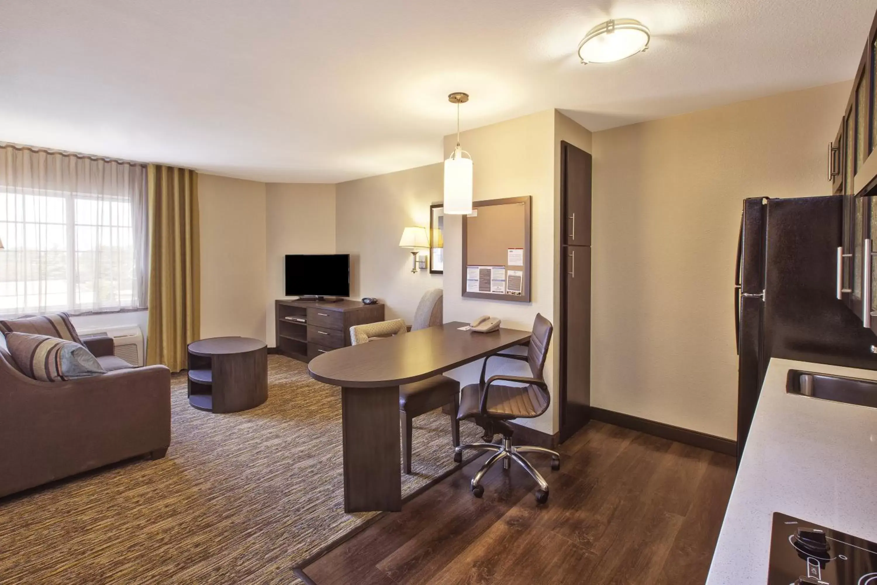 Photo of the whole room, TV/Entertainment Center in Candlewood Suites Indianapolis Airport, an IHG Hotel