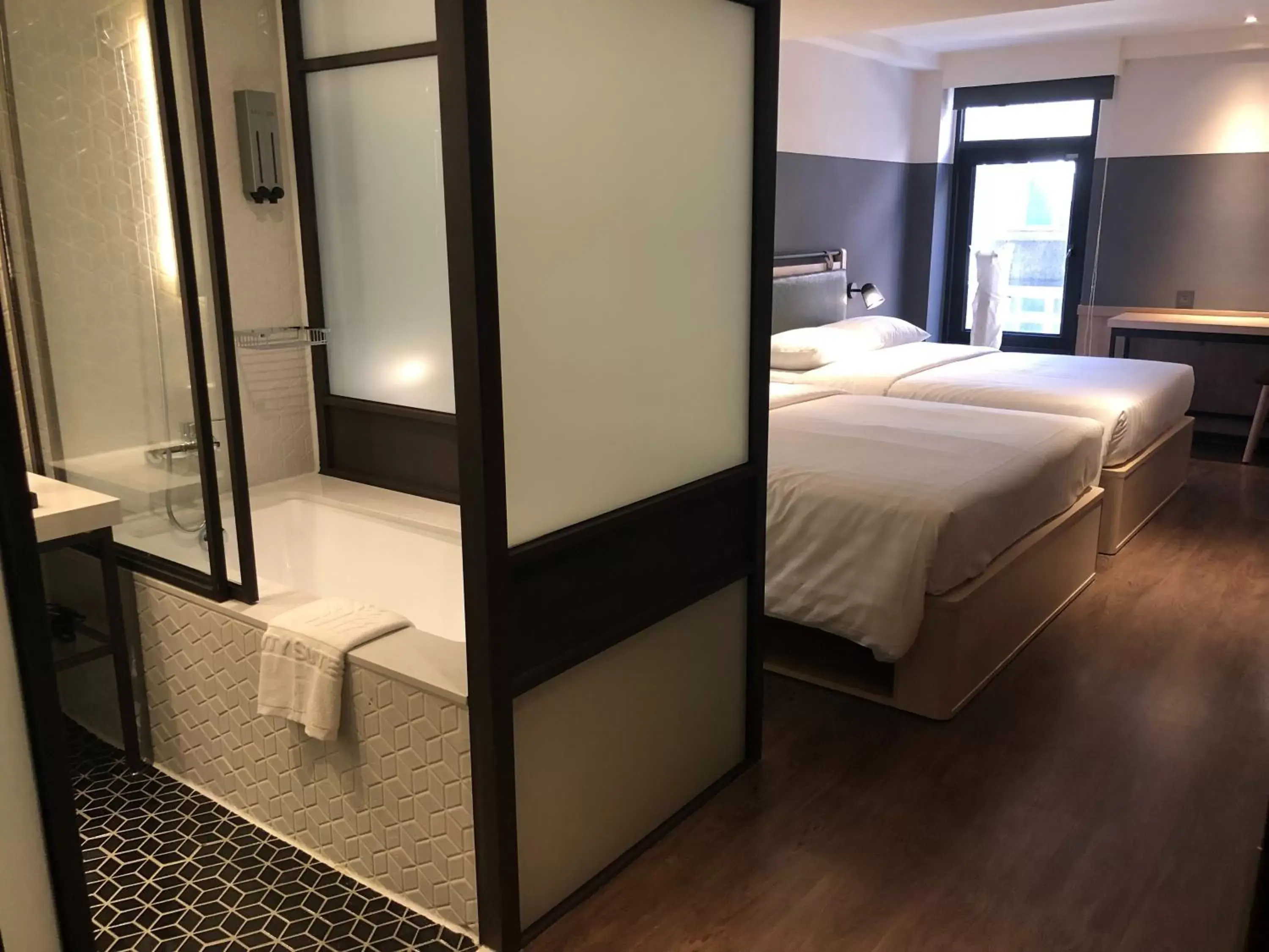 Photo of the whole room, Bed in City Suites - Main Station