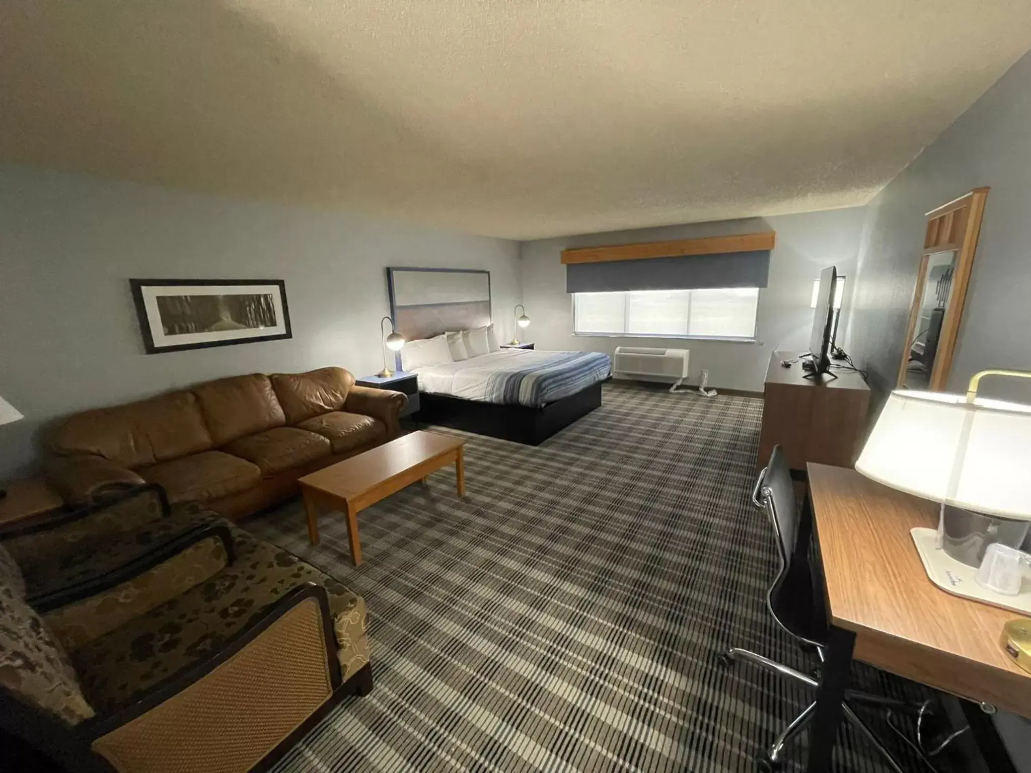 Photo of the whole room, Seating Area in AmericInn by Wyndham Sayre