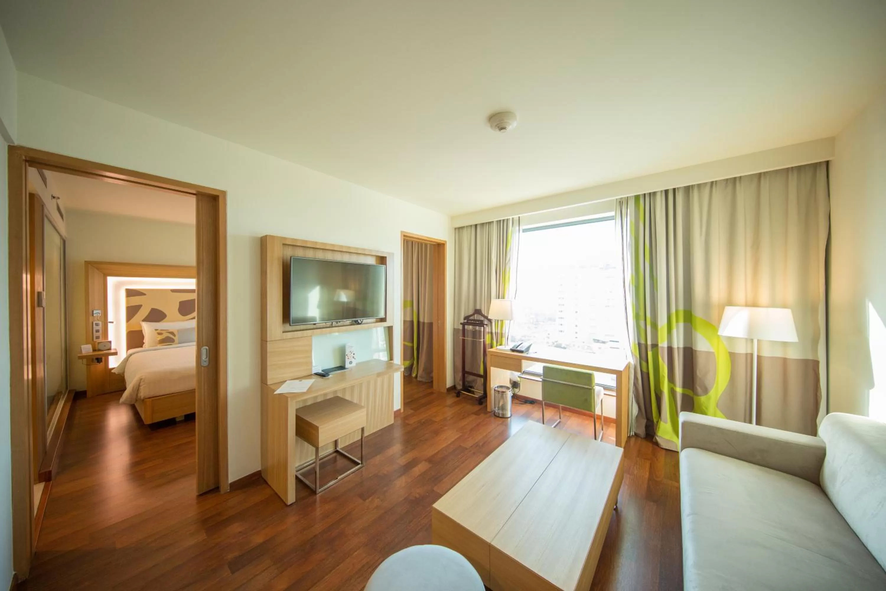 Living room, Bed in Novotel Chennai OMR