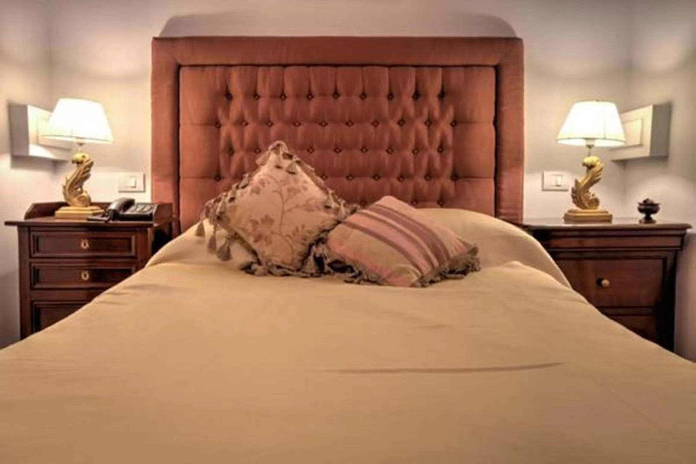 Bed in Grand Boutique Hotel