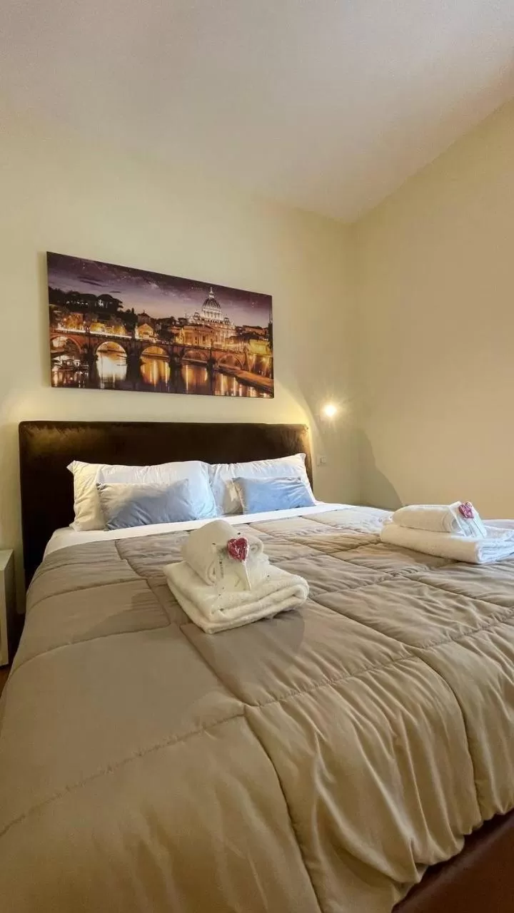 Bed in Rienzo Vatican Suites