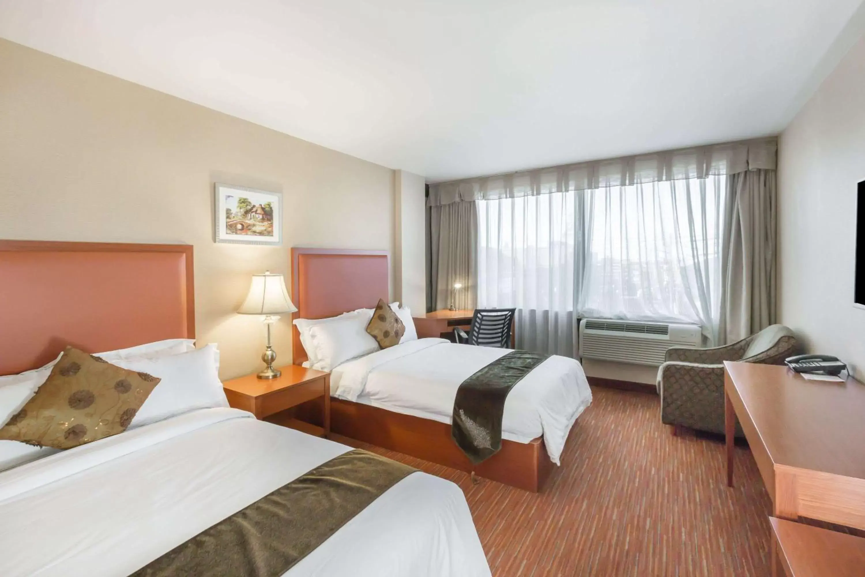 Photo of the whole room, Bed in Ramada by Wyndham Flushing Queens