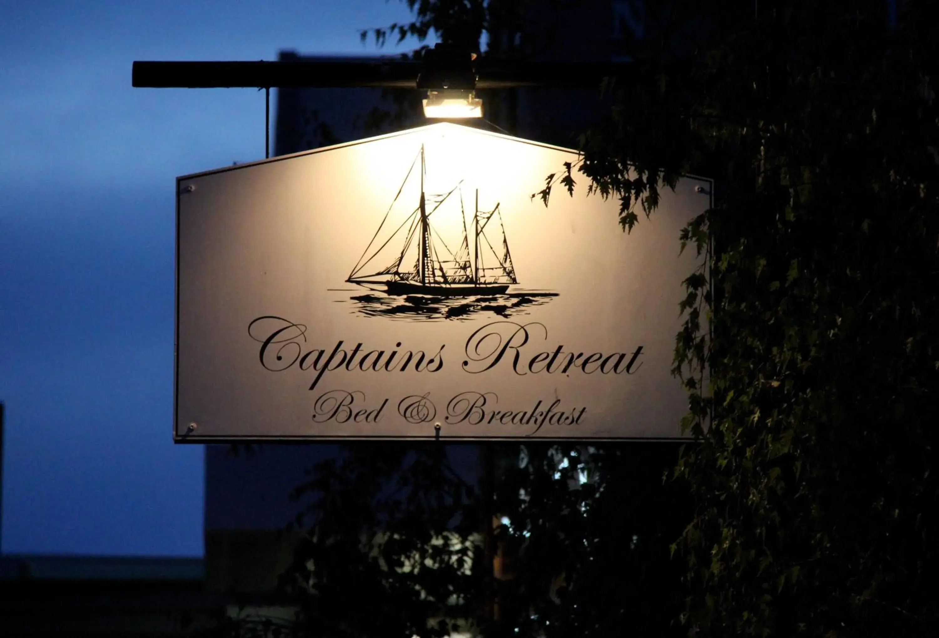 Night, Property Logo/Sign in Captains Retreat Apartments and Cottages