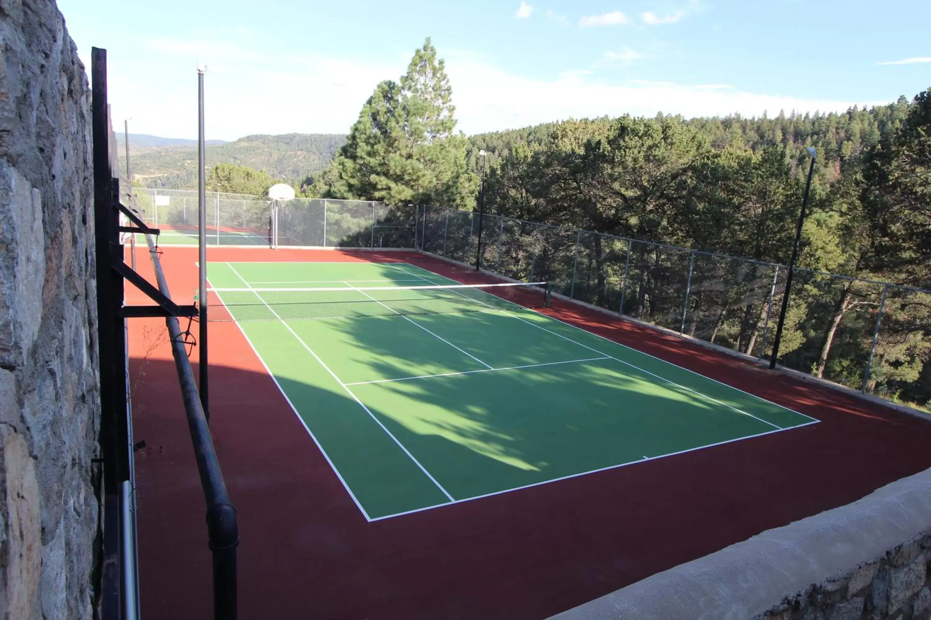 Tennis court in Crown Point Resort, by VRI Americas