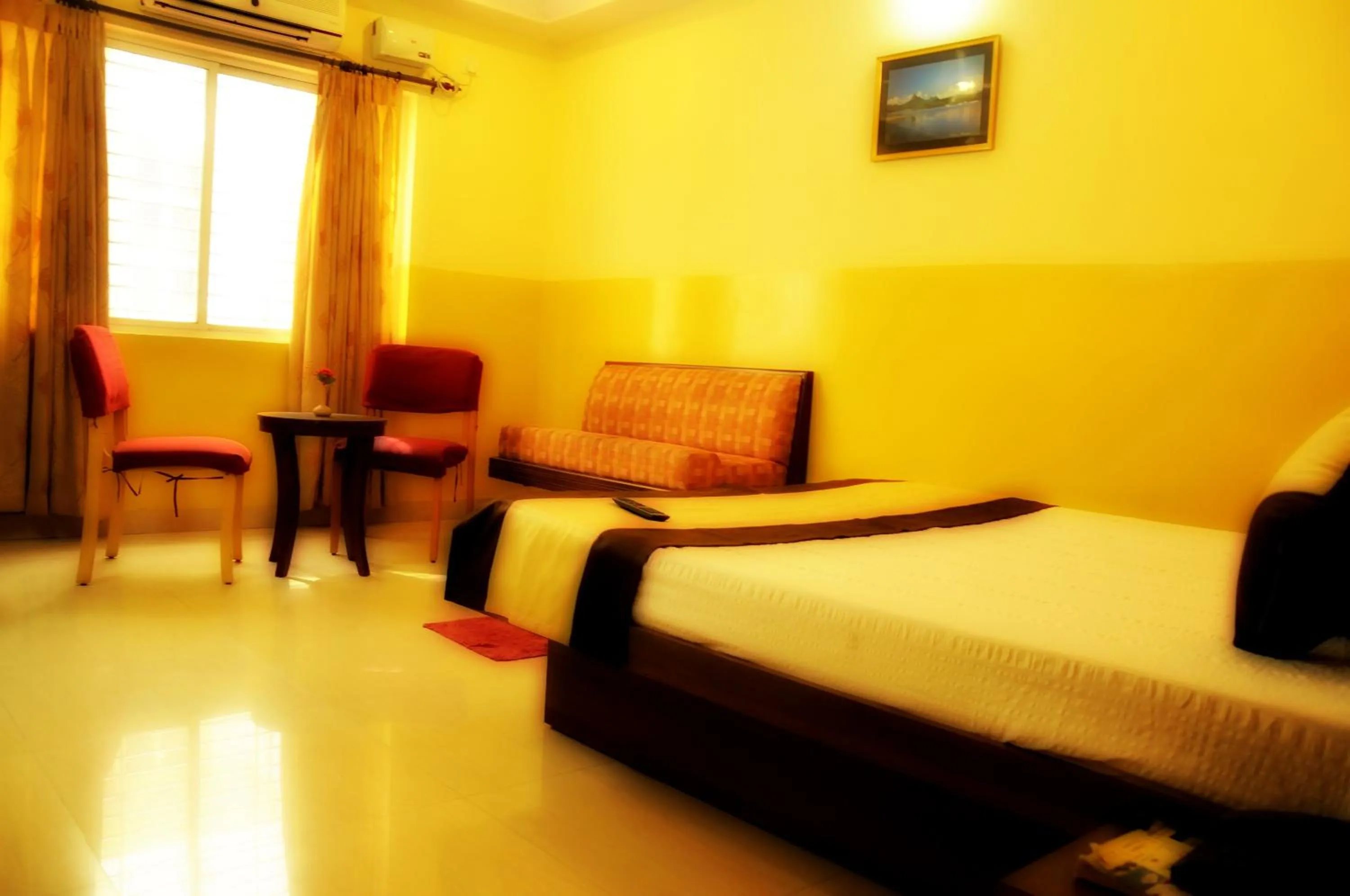 Photo of the whole room, Bed in Suvarna Residency