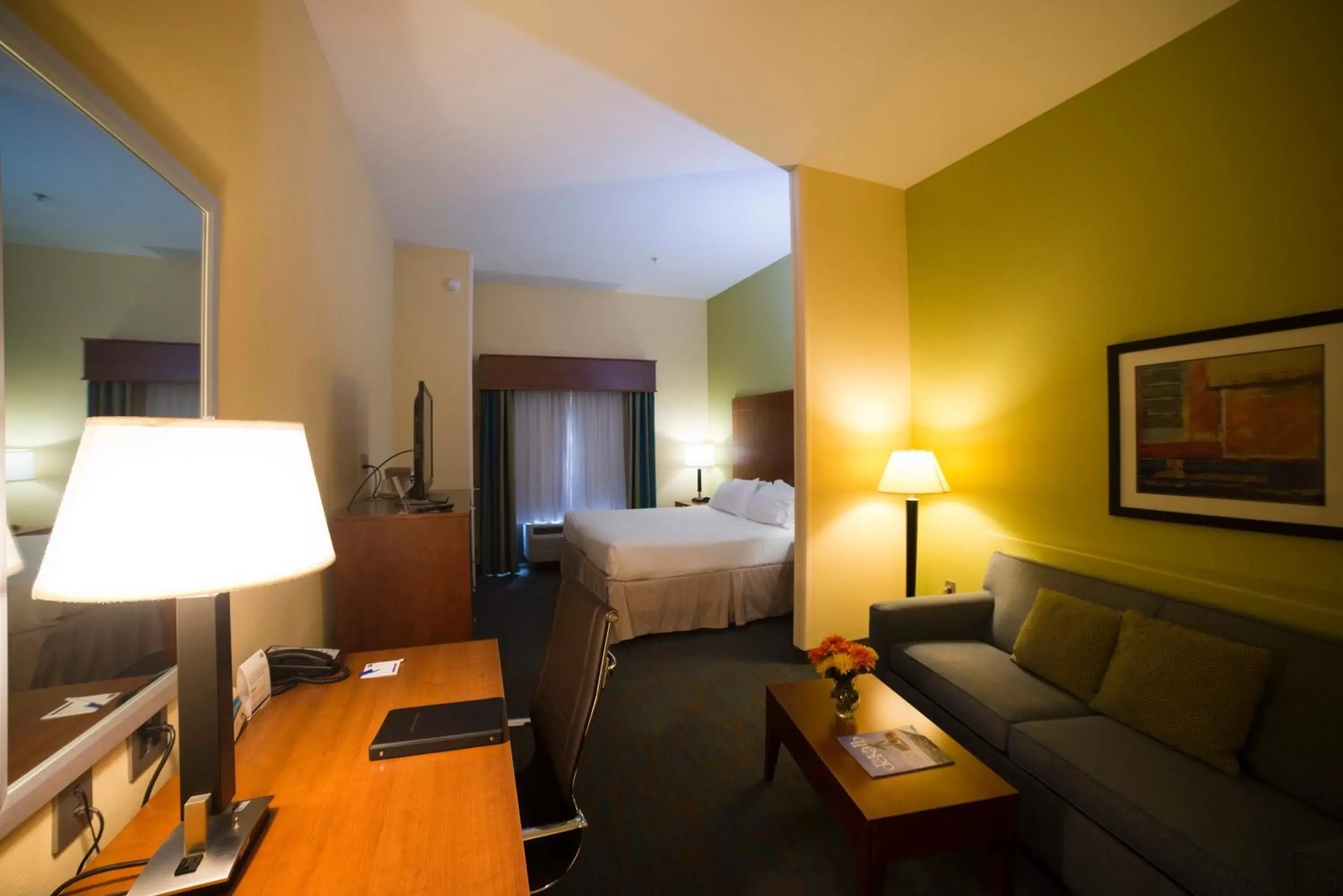 Bed, Seating Area in Holiday Inn Express Hotel & Suites Atlanta East - Lithonia, an IHG Hotel