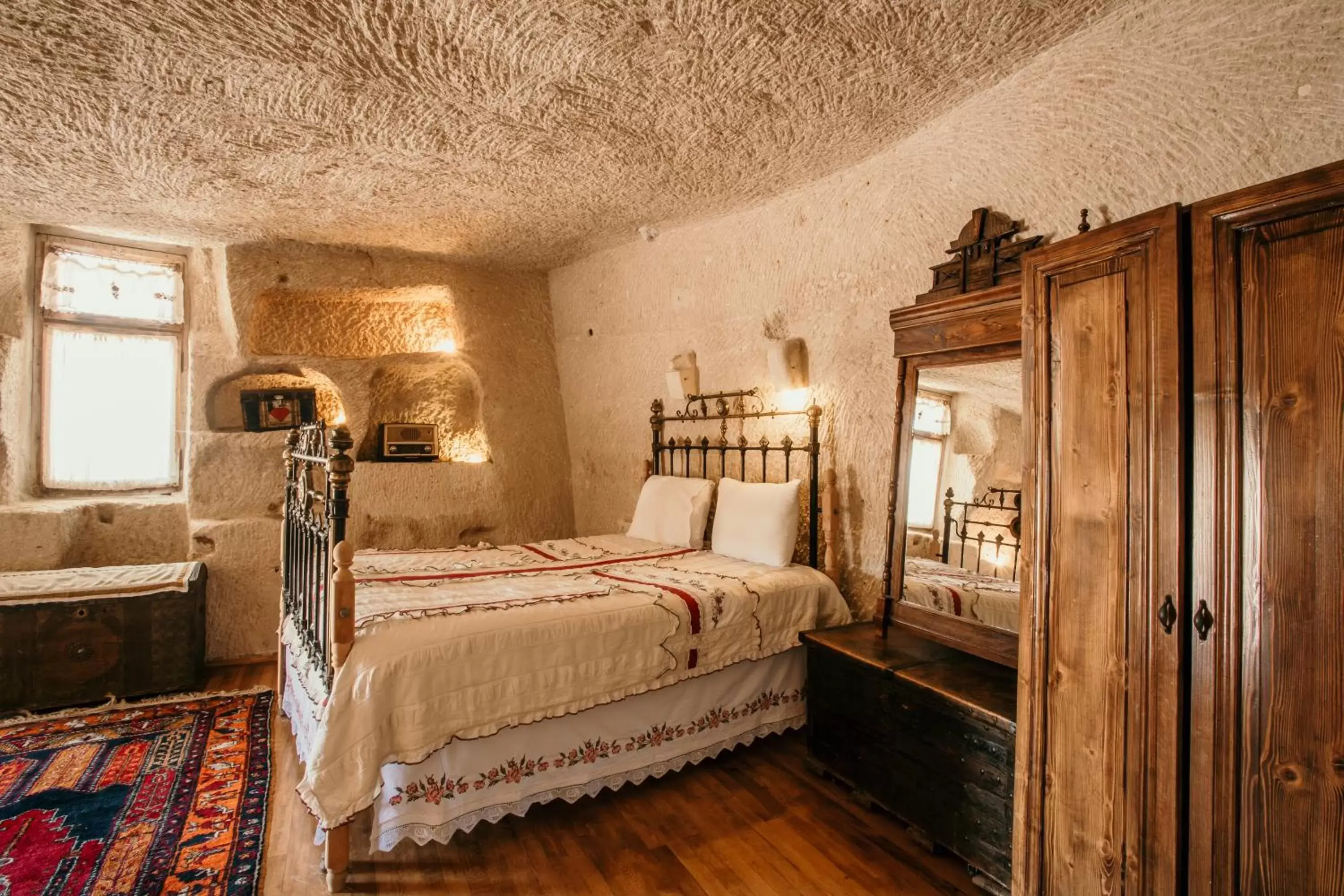 Bed in Village Cave House Hotel