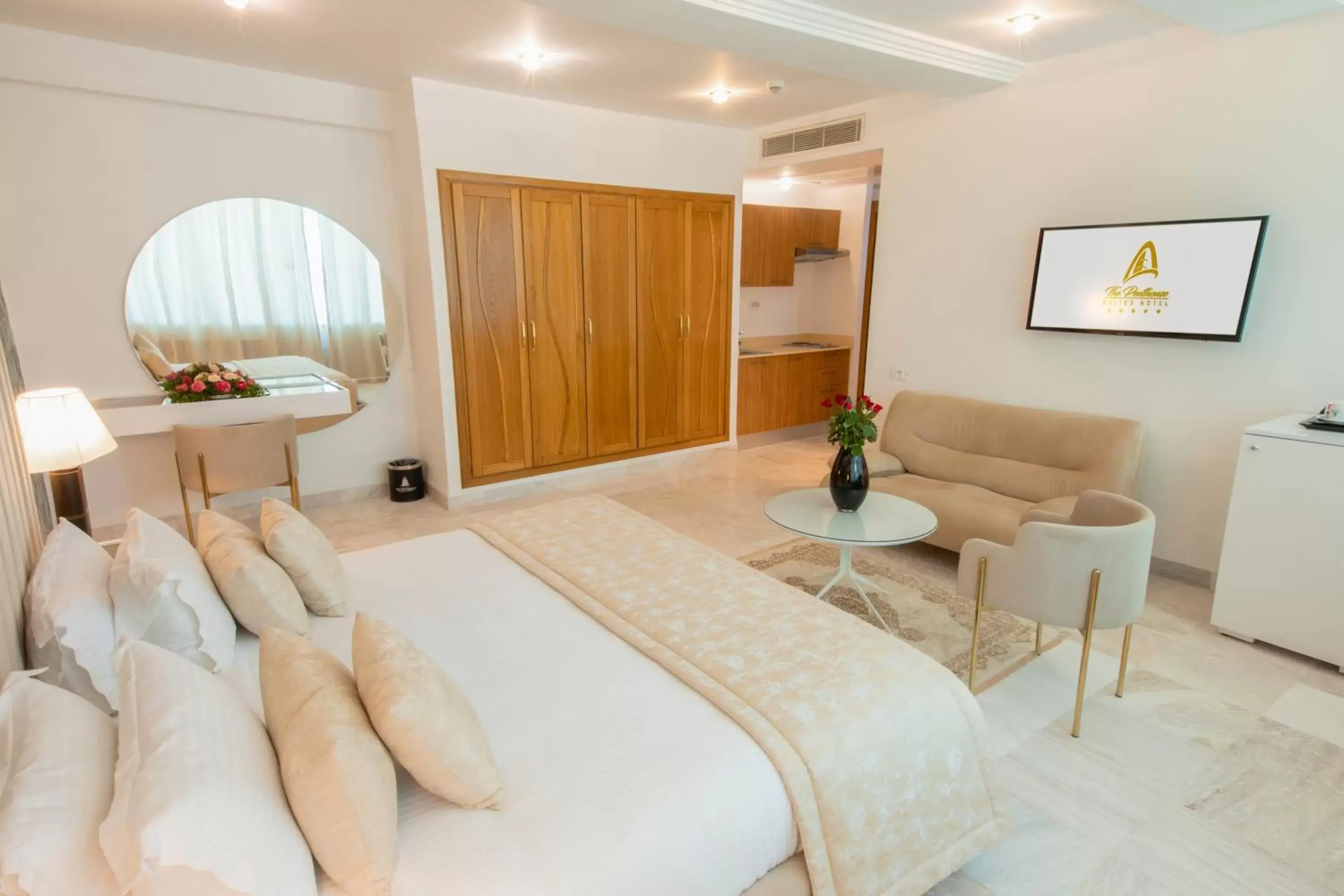 Bed, Seating Area in The Penthouse Suites Hotel