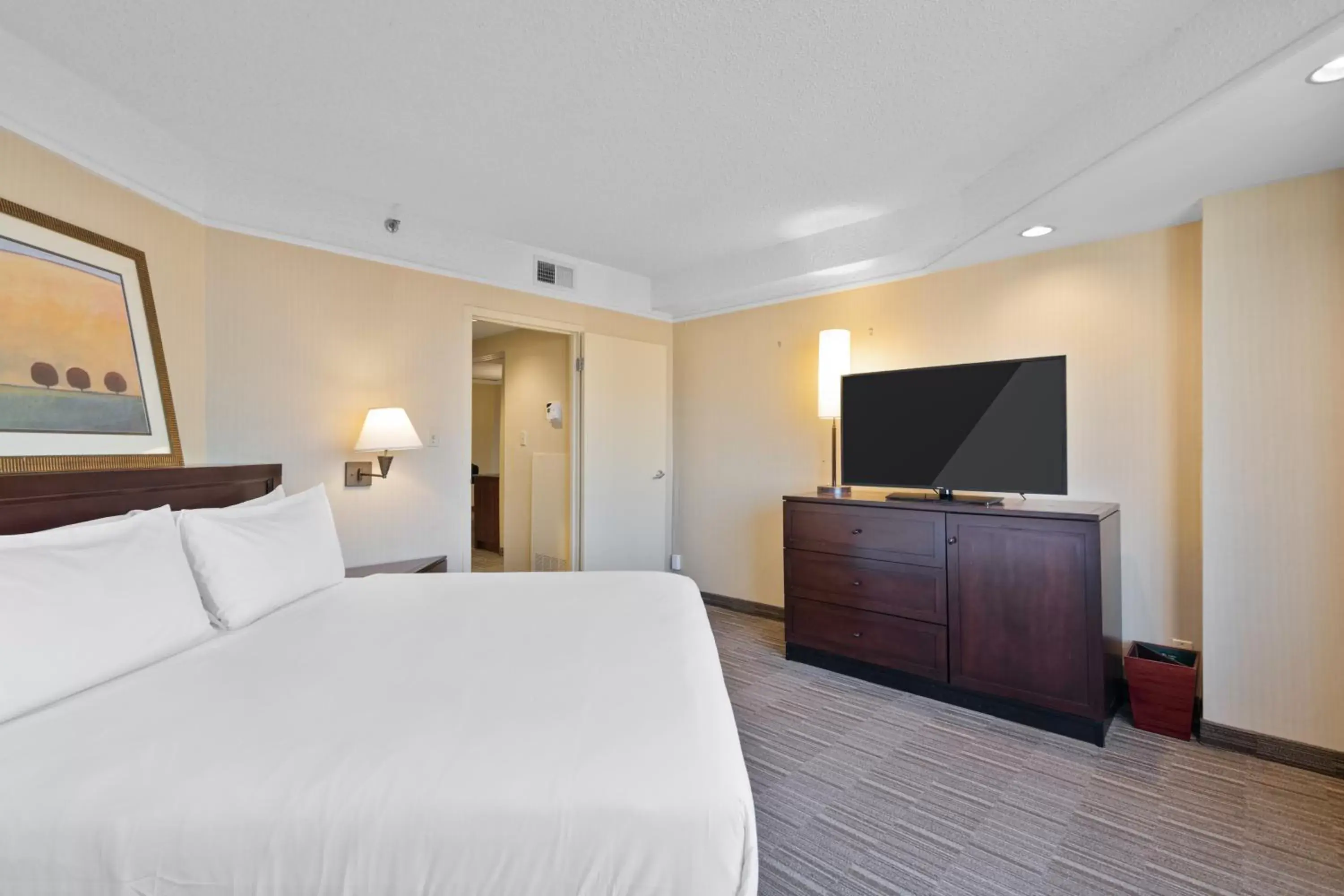 Bedroom, TV/Entertainment Center in Harmony Suites Secaucus Meadowlands