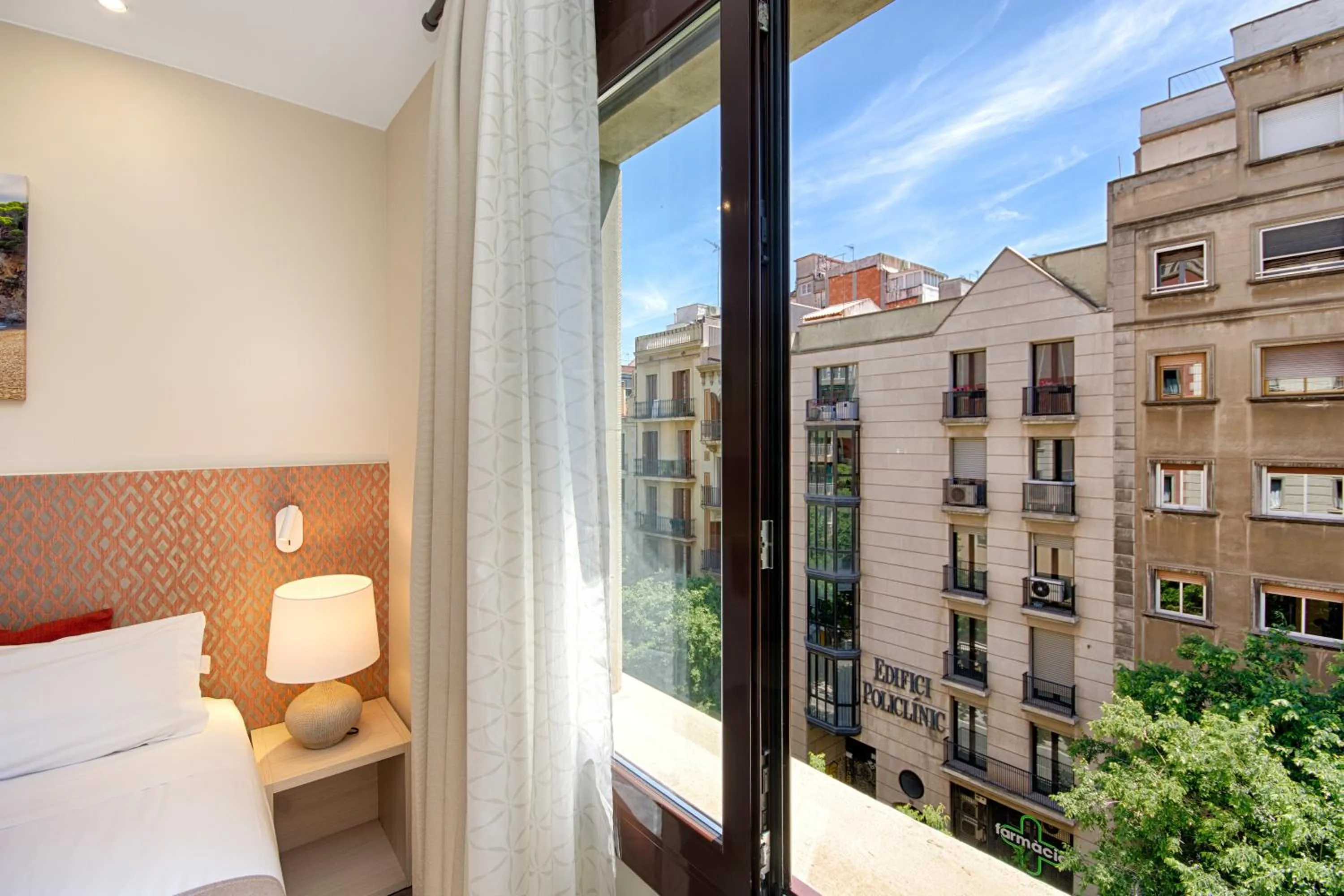 City view, Bed in Eixample Building Apartments by Mercedes Heritage