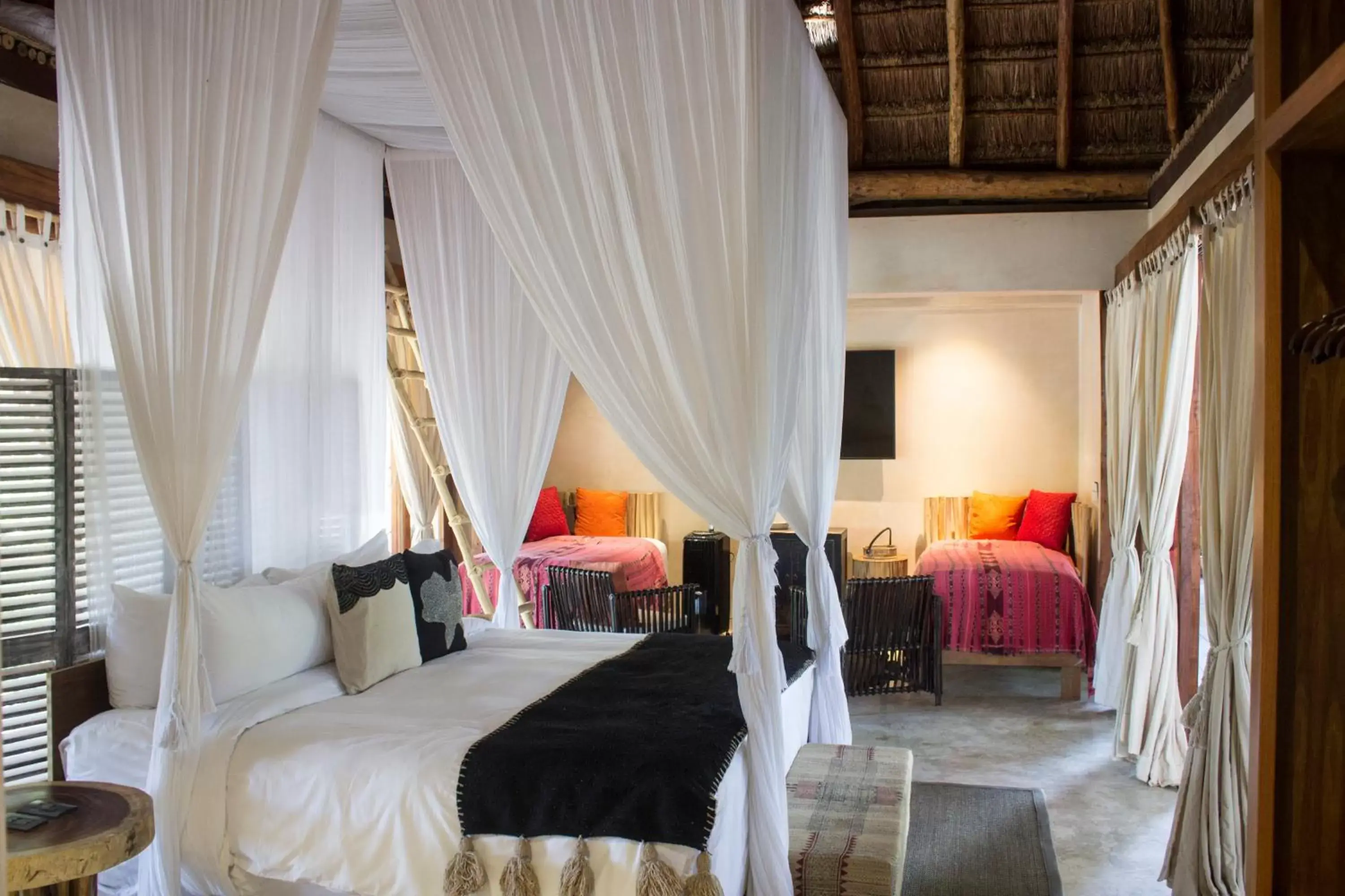 Photo of the whole room, Bed in Orchid House Tulum