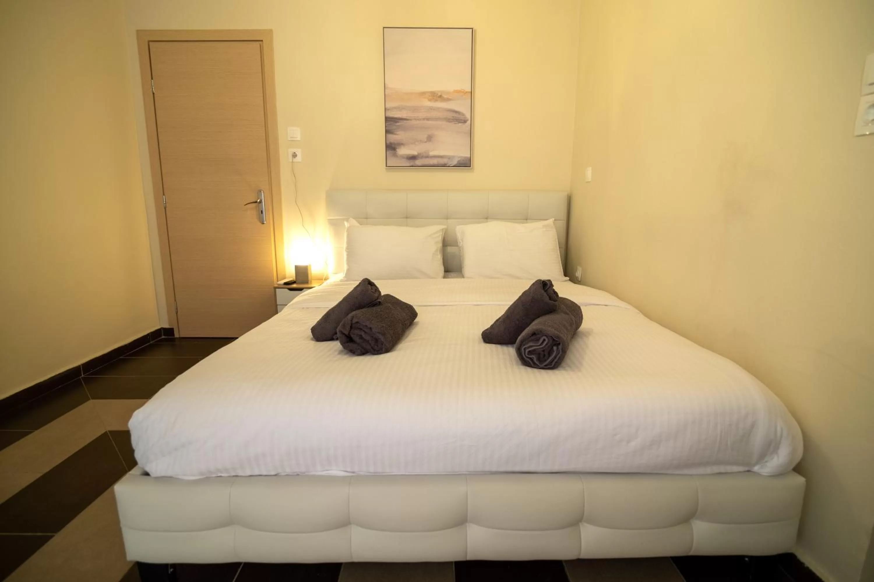 Bed in Votsalakia Hotel & Luxury Apartments