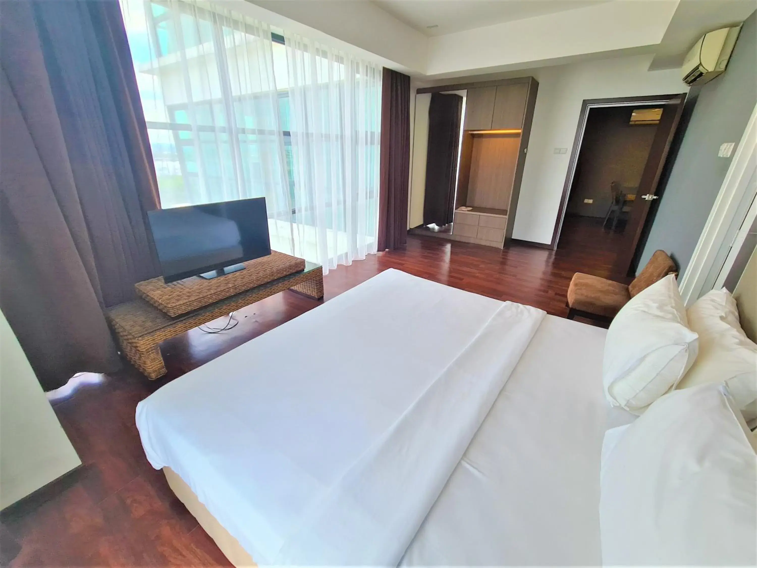 Bed in Nexus Regency Suites & Hotel