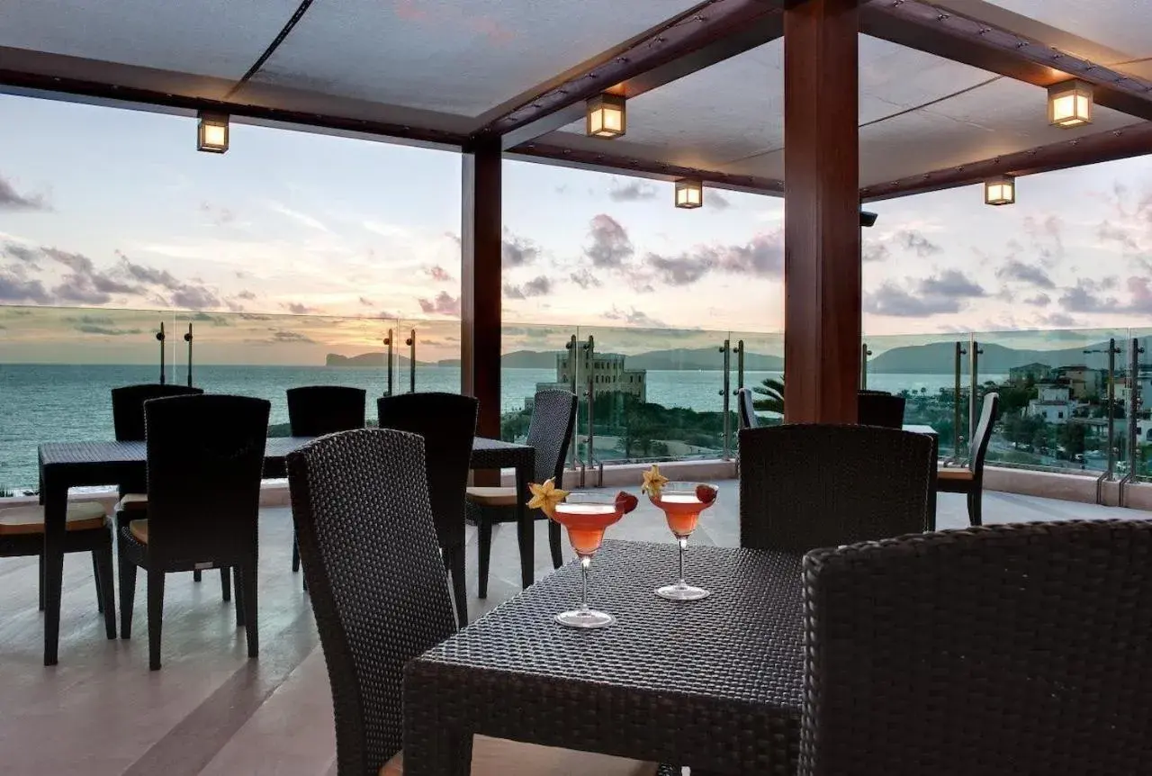 Lounge or bar in Smy Carlos V Wellness & Spa Alghero Lounge or bar in Smy Carlos V Wellness & Spa Alghero