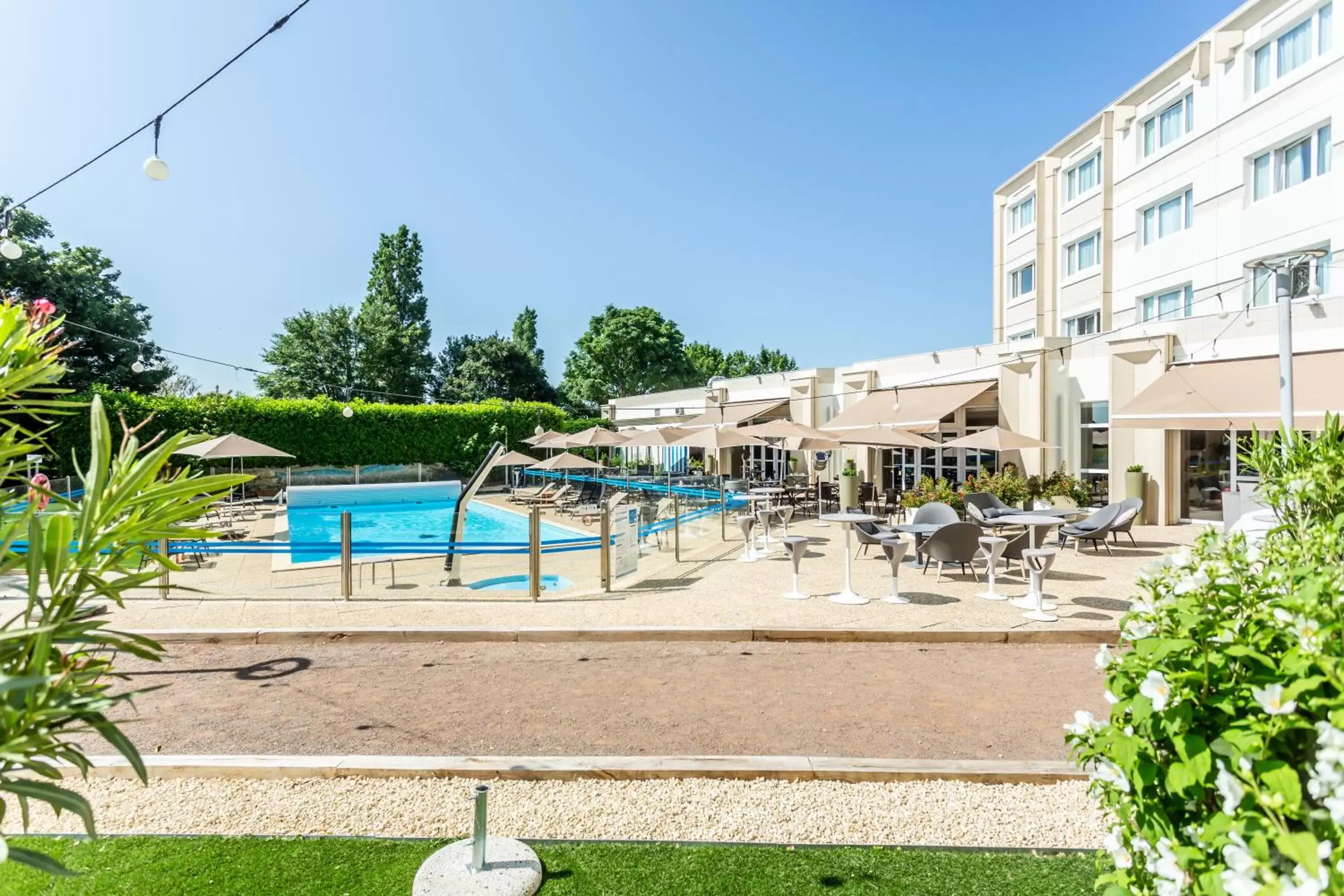 Patio, Swimming Pool in Novotel Bourges