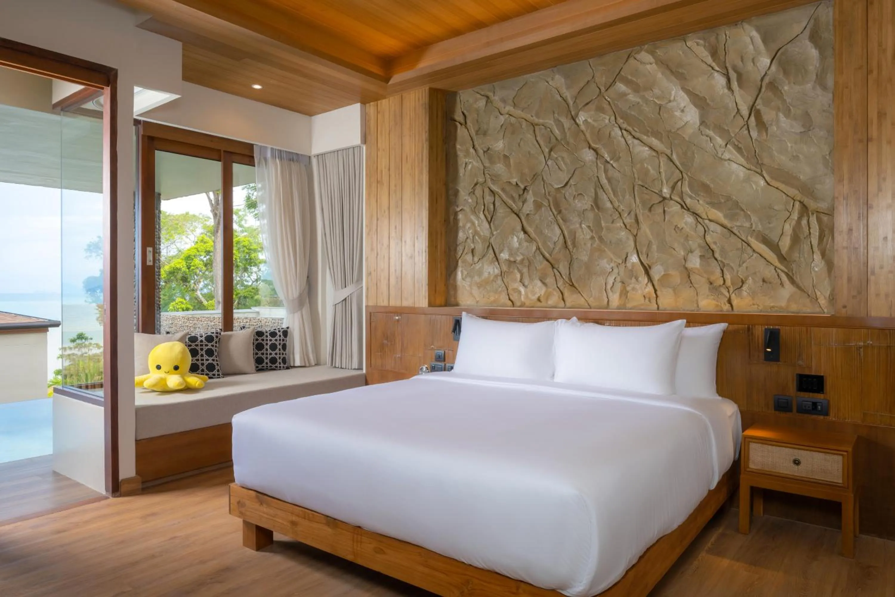 Bed in SINAE Phuket Luxury Hotel