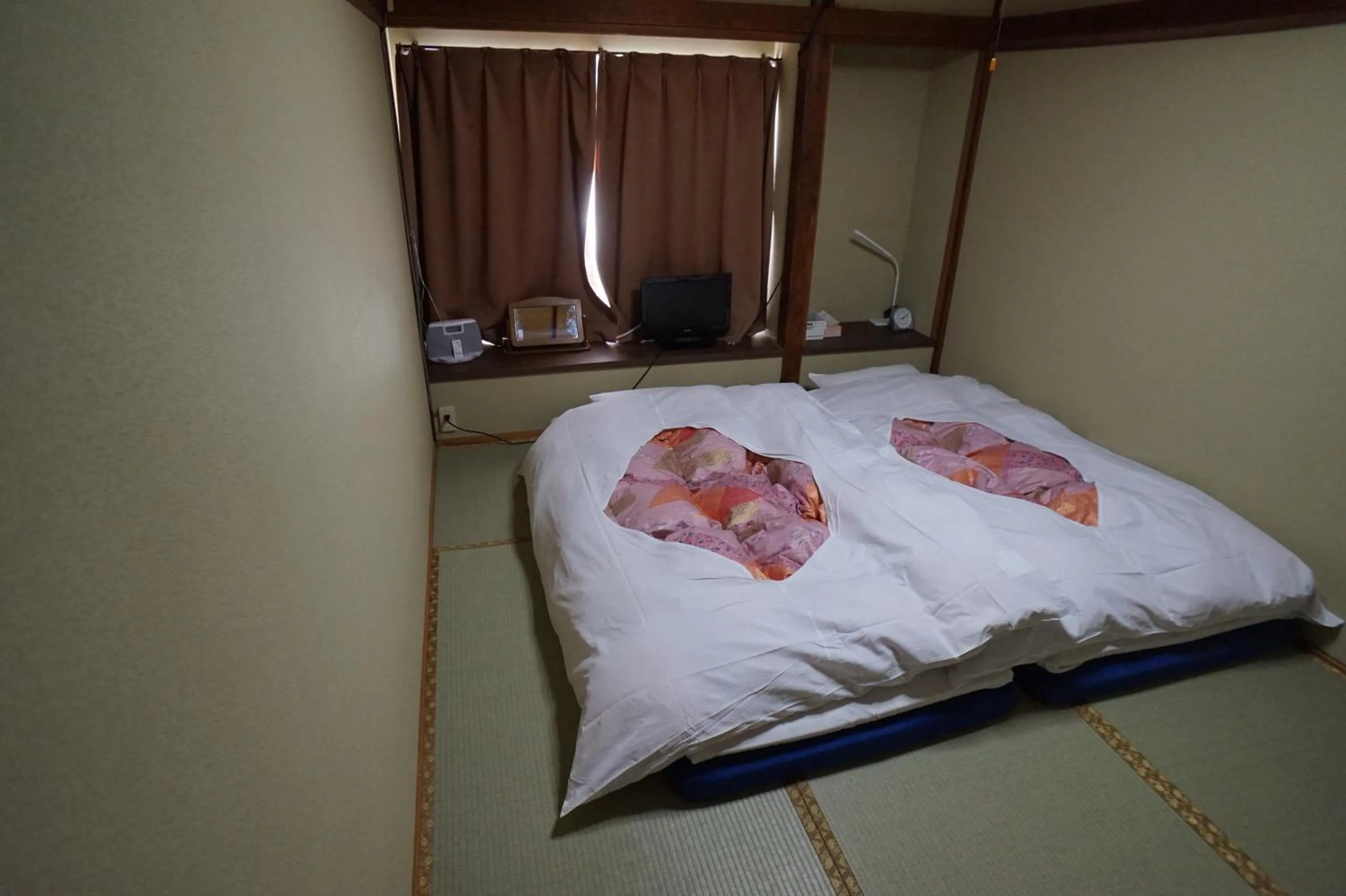 Photo of the whole room, Bed in Ryokan Katsutaro