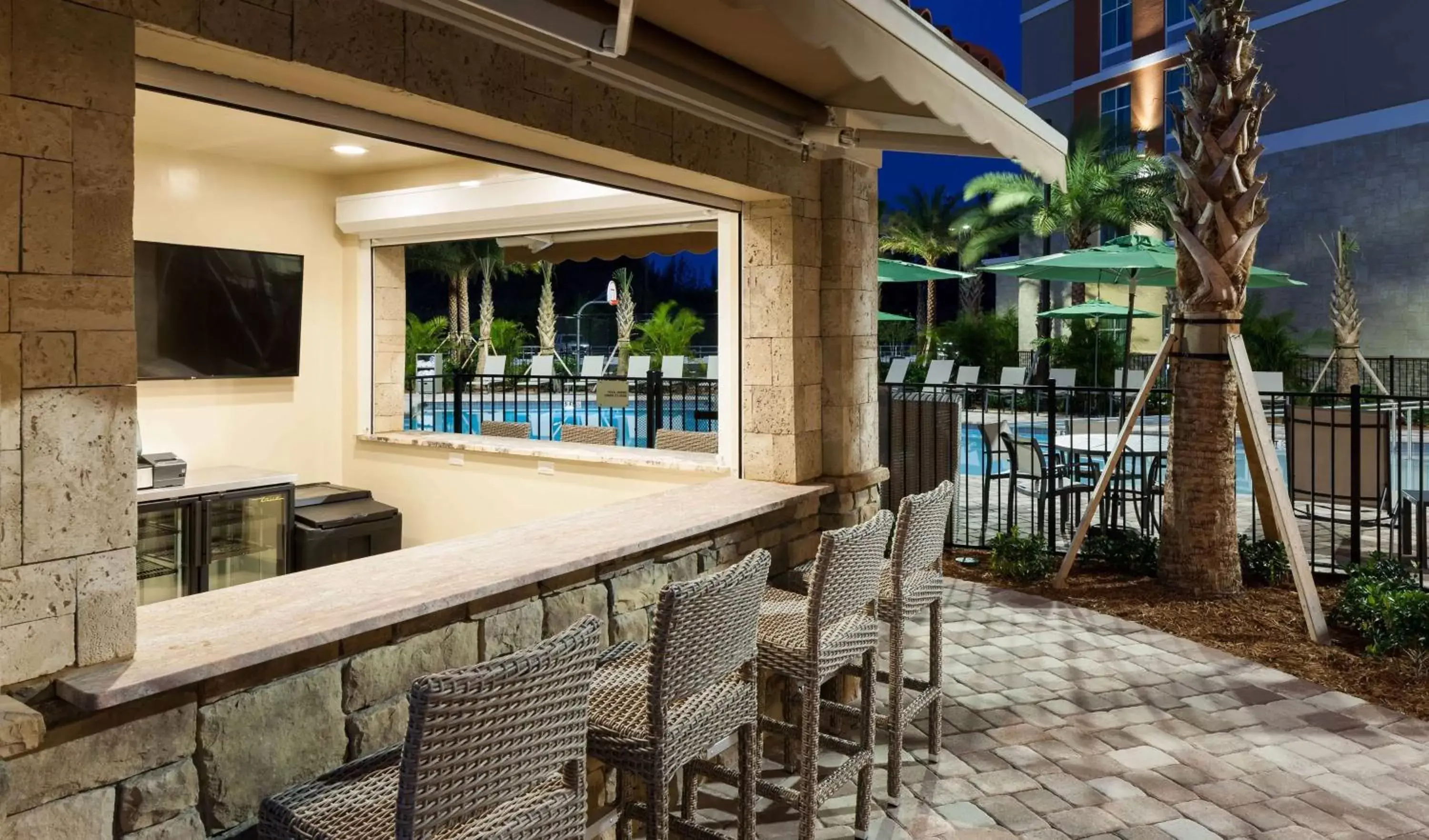 Lounge or bar, Swimming Pool in Homewood Suites by Hilton Cape Canaveral-Cocoa Beach