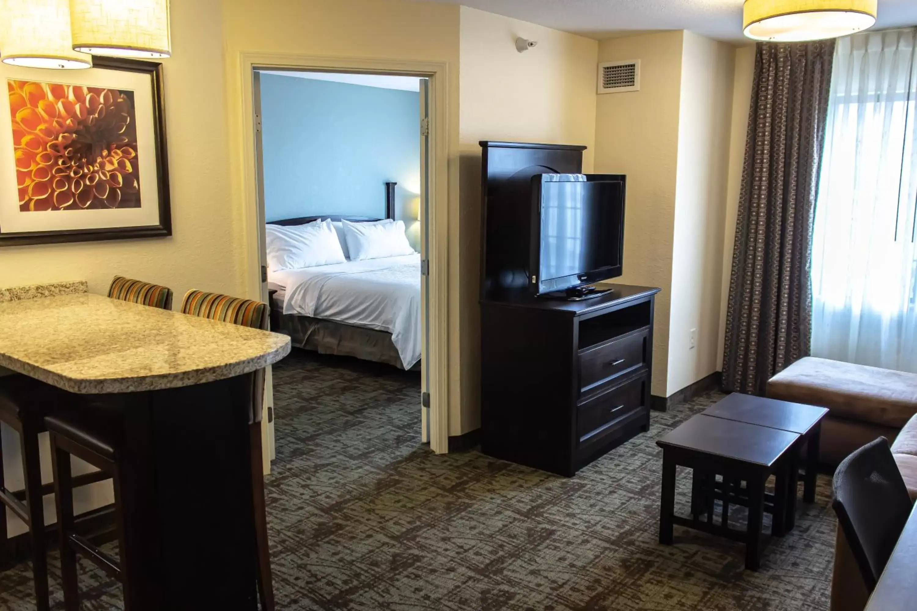 Photo of the whole room, TV/Entertainment Center in Staybridge Suites Minot, an IHG Hotel