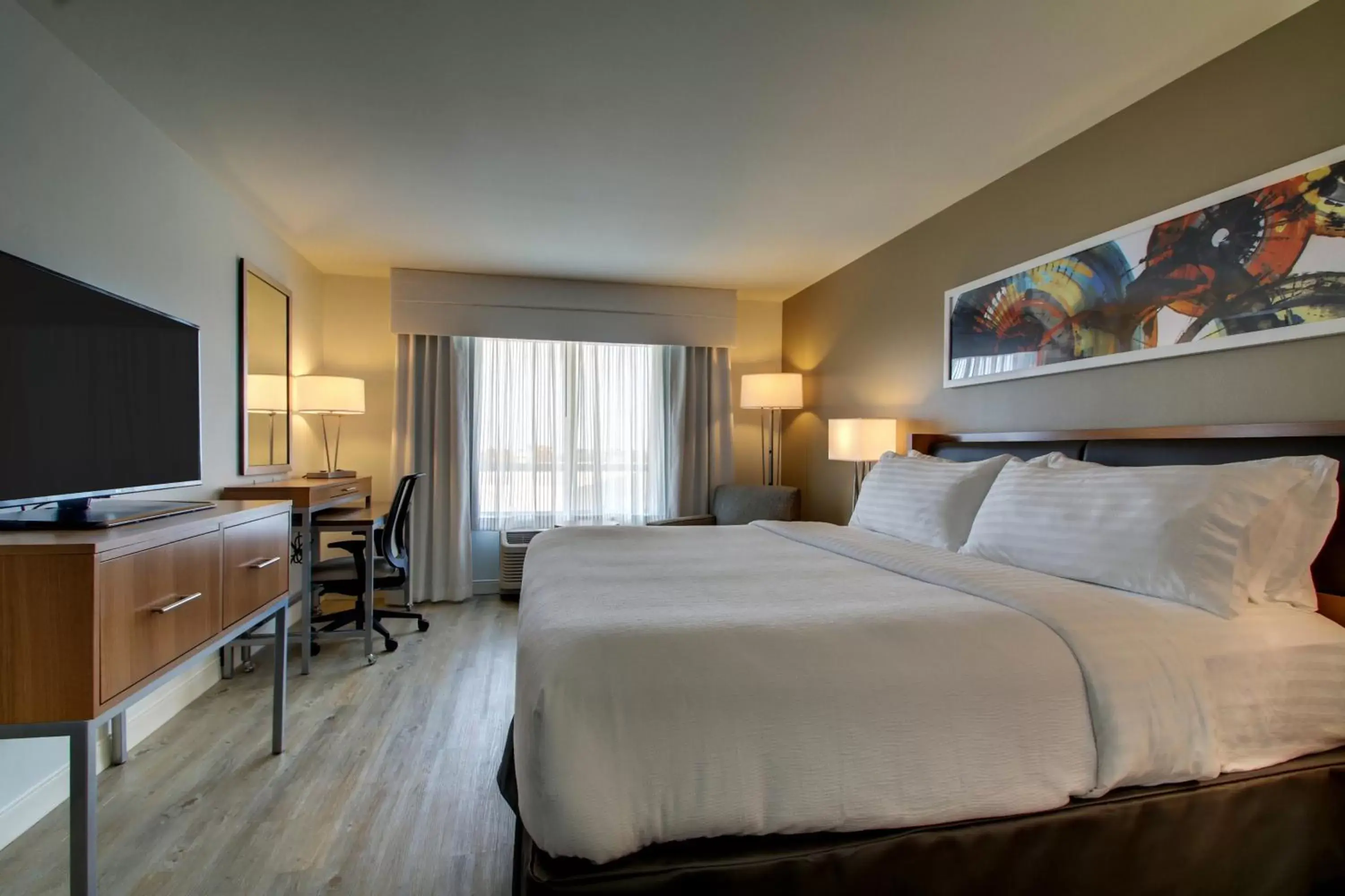 Bed in Holiday Inn & Suites Peoria at Grand Prairie, an IHG Hotel