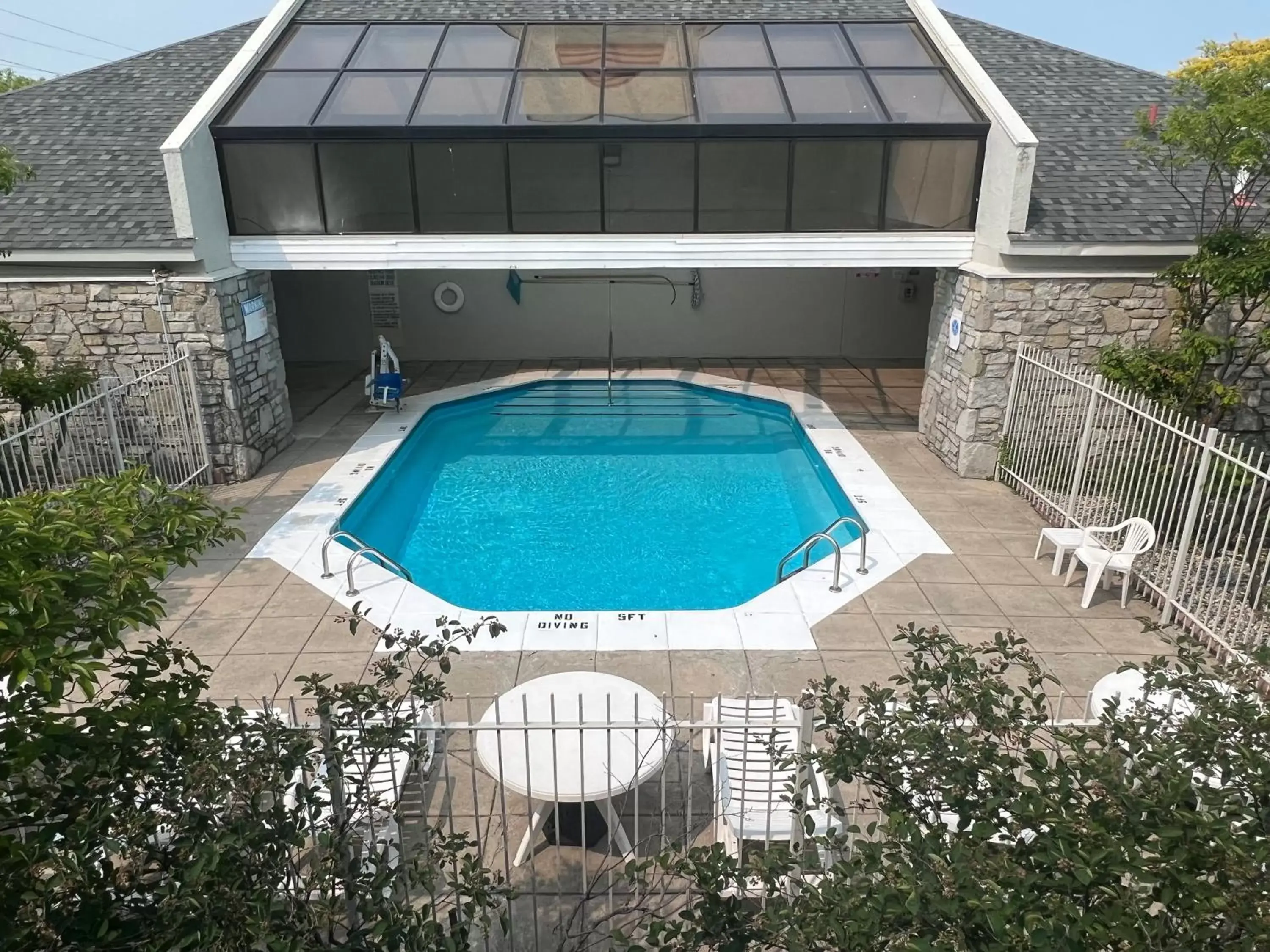 Property building, Swimming Pool in Days Inn & Suites by Wyndham Monroe