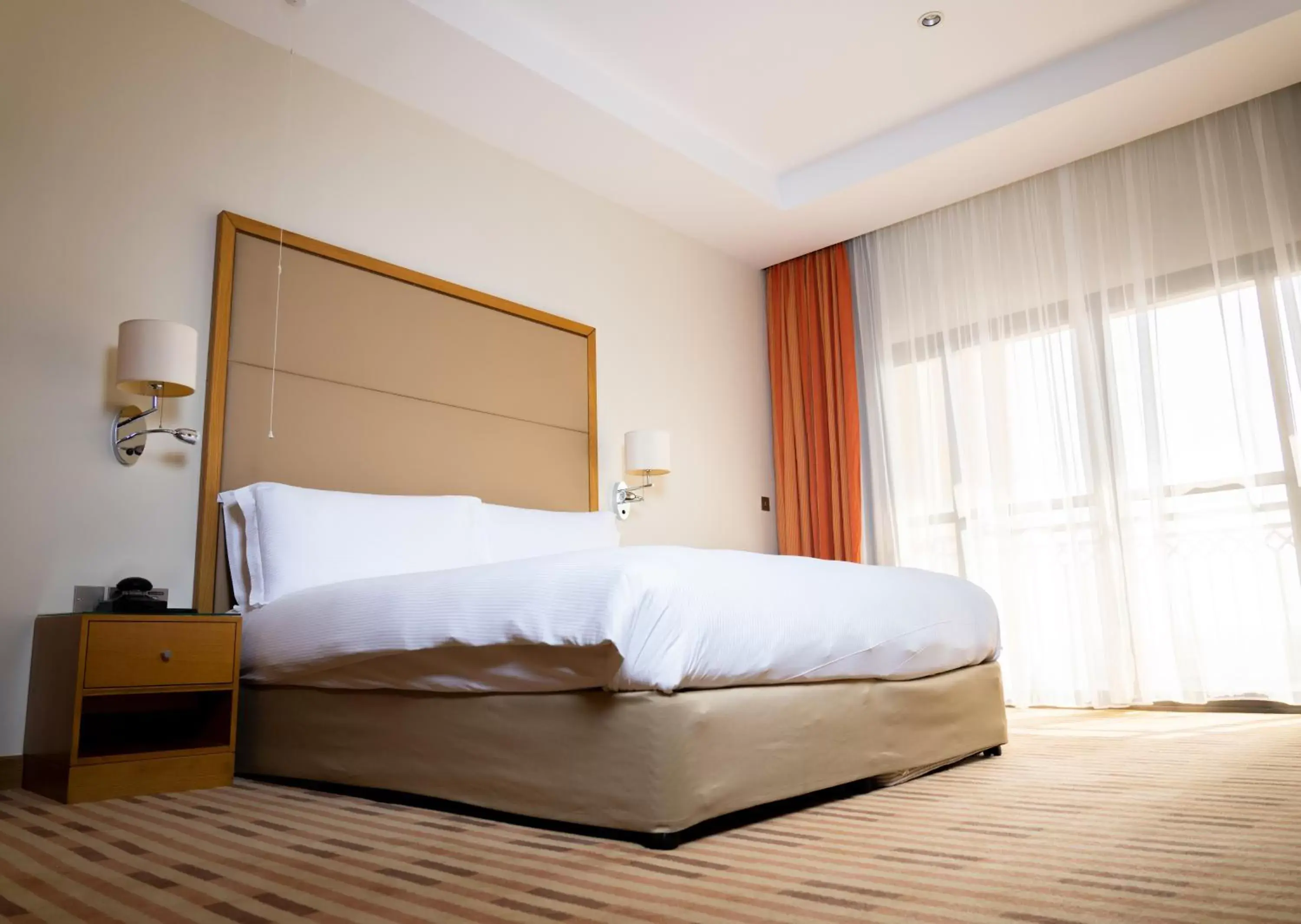 Bed in Crowne Plaza Sohar, an IHG Hotel