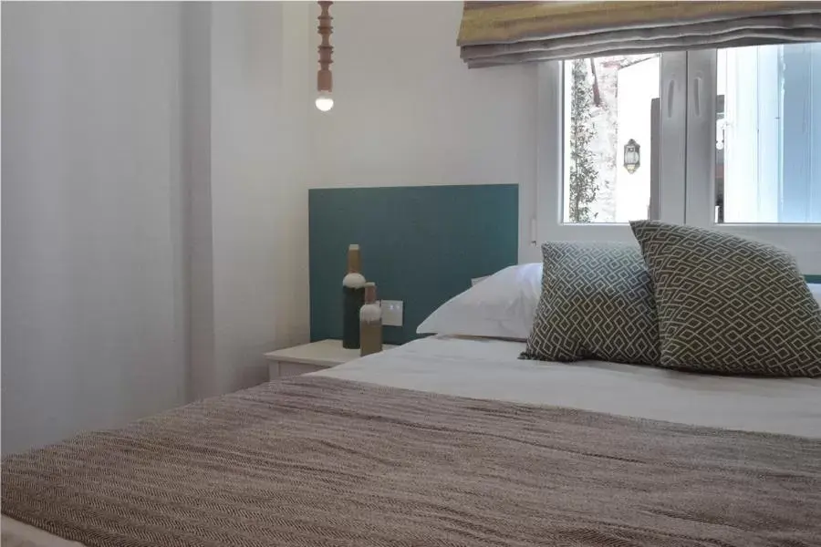 Quiet street view, Bed in Meltemi by Manthos Hotels